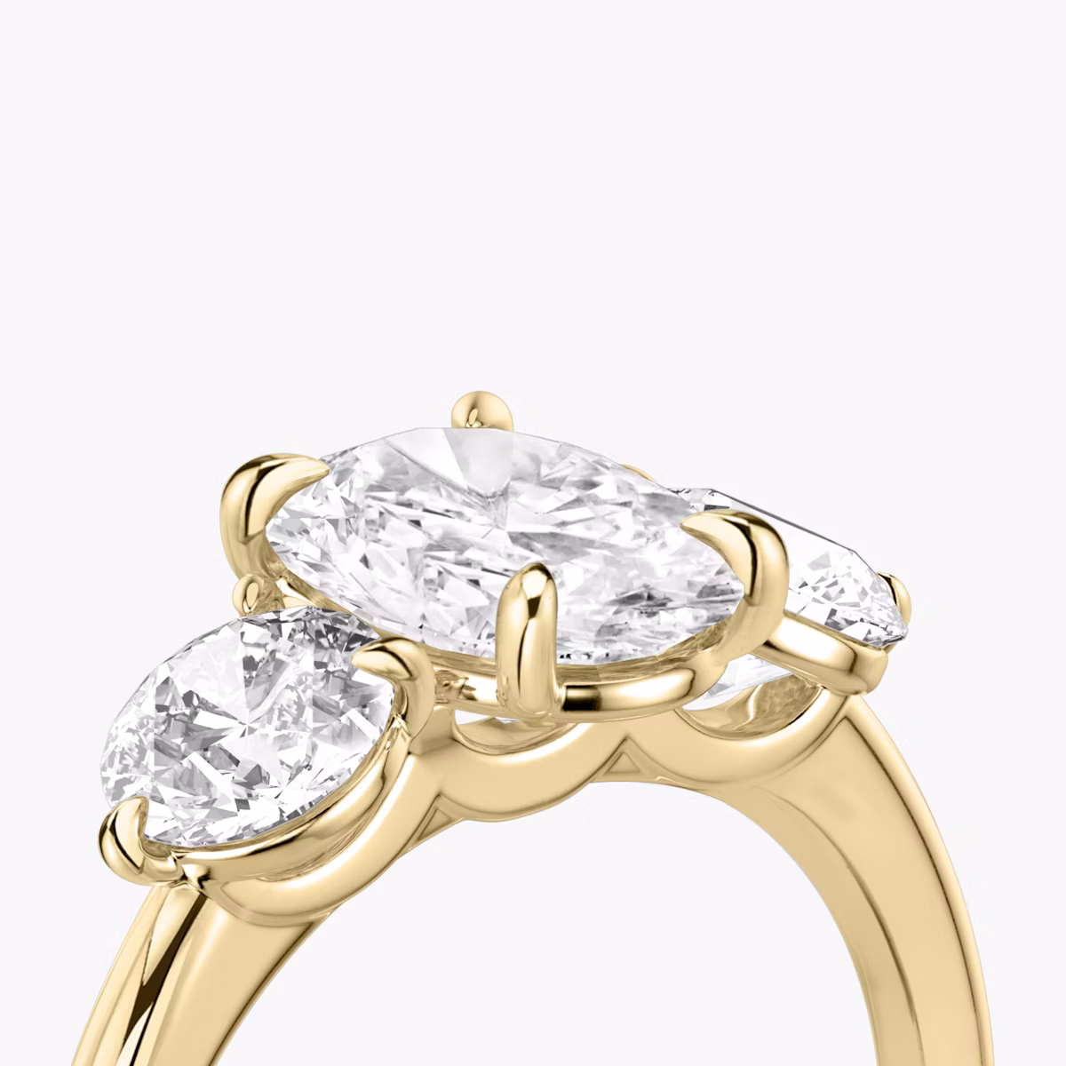 The Three Stone | Oval | 18k | Yellow Gold | bandAccent: Plain | sideStoneCarat: 0.50ct | sideStoneShape: Round Brilliant | diamondOrientation: vertical | caratWeight: other