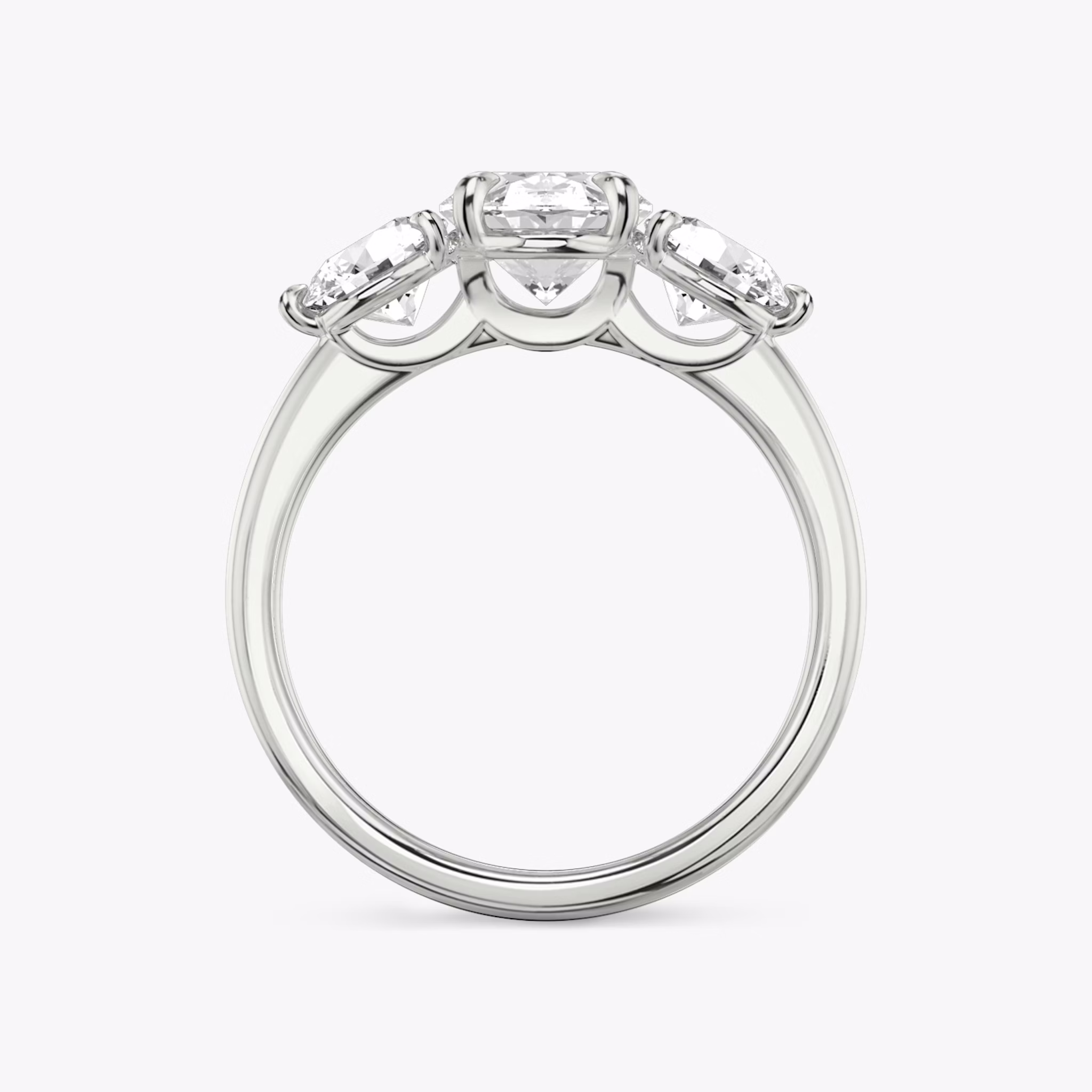 The Three Stone | Oval | 18k | White Gold | bandAccent: Plain | sideStoneCarat: 0.50ct | sideStoneShape: Round Brilliant | diamondOrientation: vertical | caratWeight: other