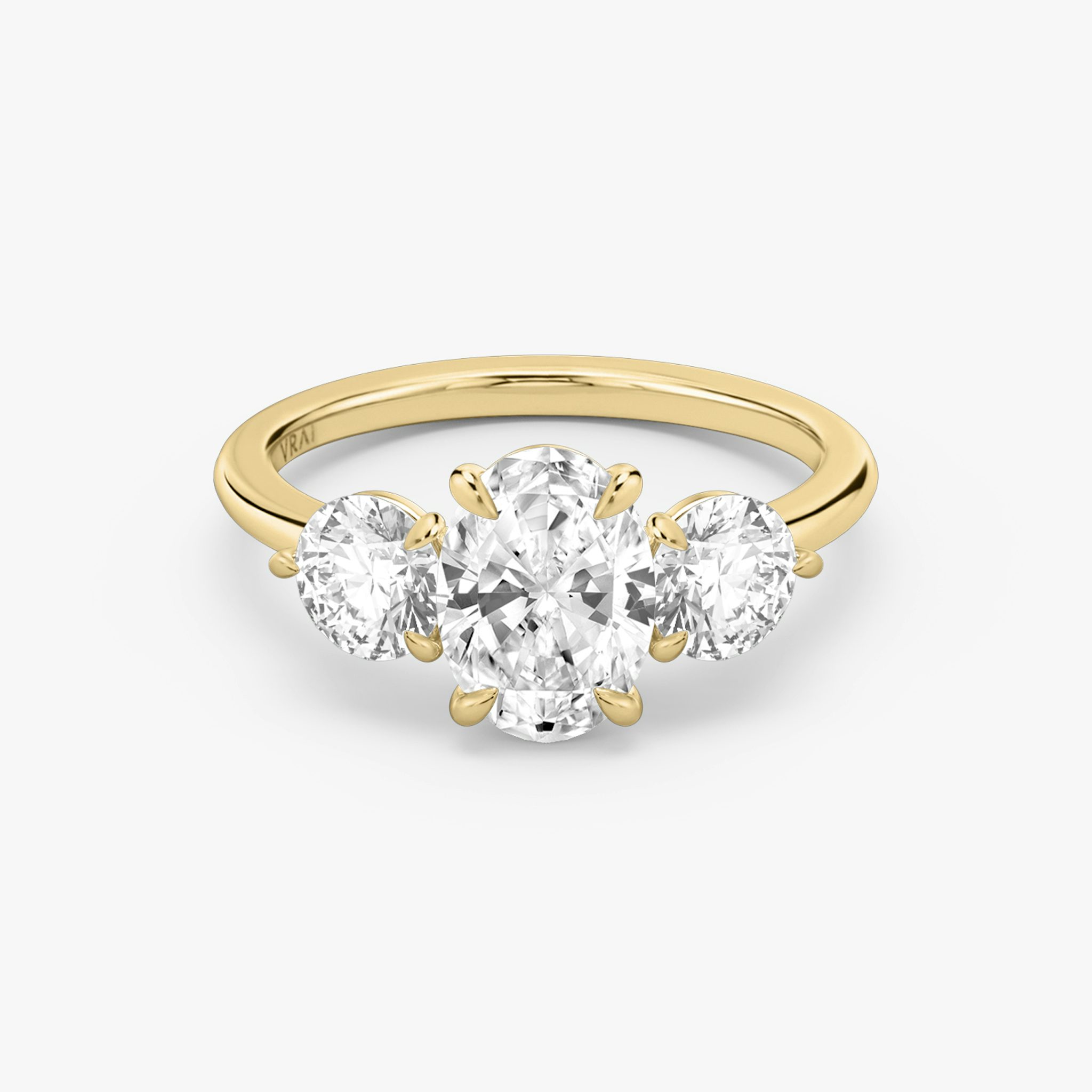 The Three Stone | Oval | 18k | Yellow Gold | bandAccent: Plain | sideStoneCarat: 0.50ct | sideStoneShape: Round Brilliant | diamondOrientation: vertical | caratWeight: other