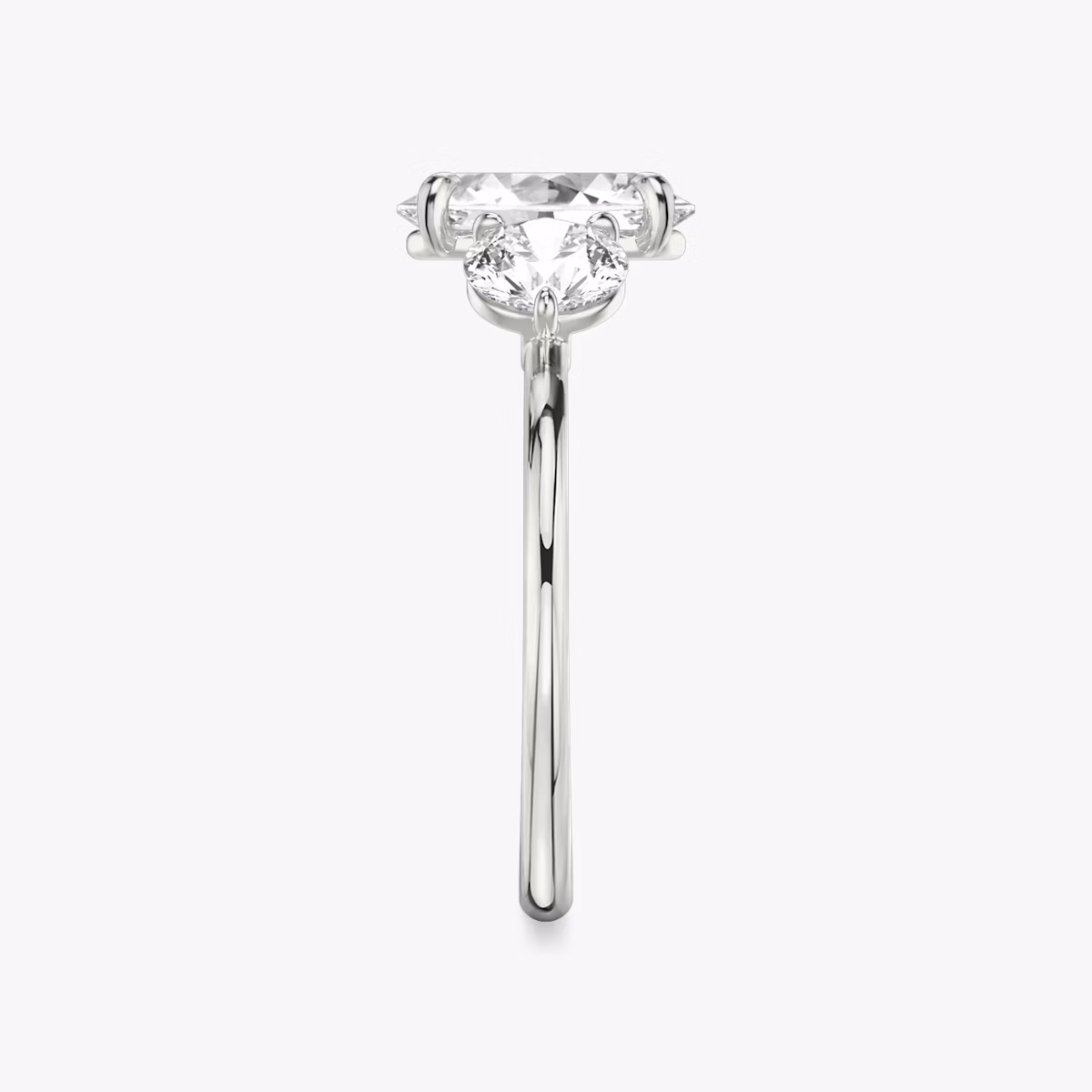 The Three Stone | Oval | Platinum | bandAccent: Plain | sideStoneCarat: 0.50ct | sideStoneShape: Round Brilliant | diamondOrientation: vertical | caratWeight: other