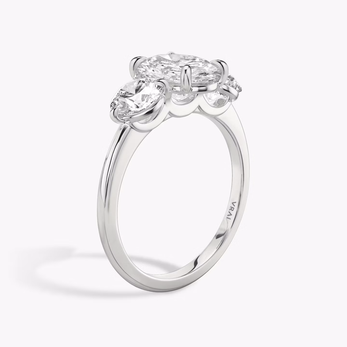The Three Stone | Oval | Platinum | bandAccent: Plain | sideStoneCarat: 0.50ct | sideStoneShape: Round Brilliant | diamondOrientation: vertical | caratWeight: other