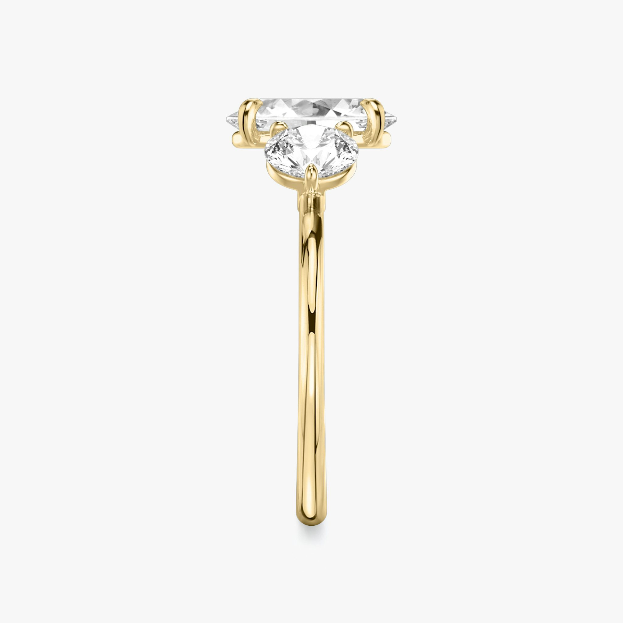 The Three Stone | Oval | 18k | Yellow Gold | bandAccent: Plain | sideStoneCarat: 0.50ct | sideStoneShape: Round Brilliant | diamondOrientation: vertical | caratWeight: other