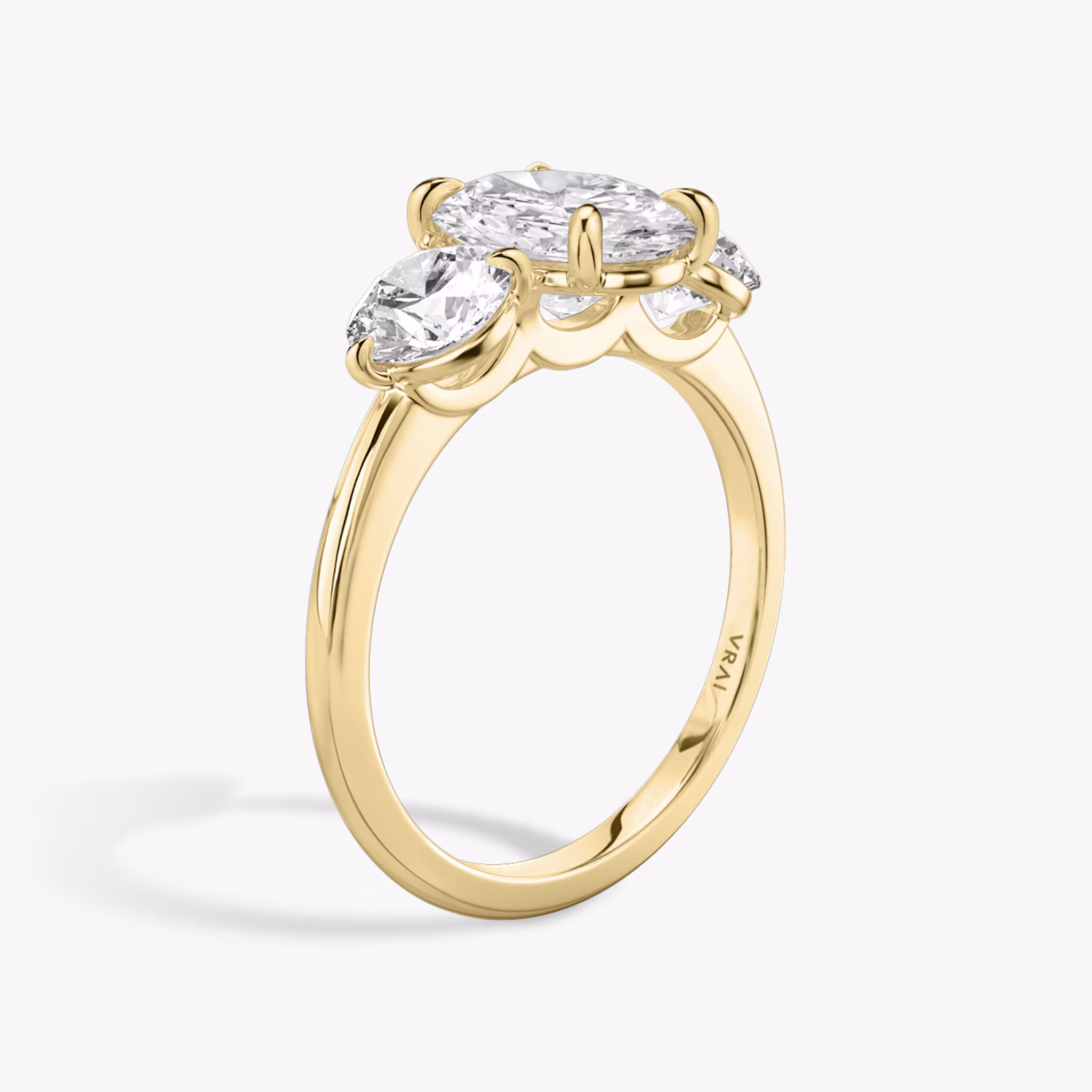 The Three Stone | Oval | 18k | Yellow Gold | bandAccent: Plain | sideStoneCarat: 0.50ct | sideStoneShape: Round Brilliant | diamondOrientation: vertical | caratWeight: other