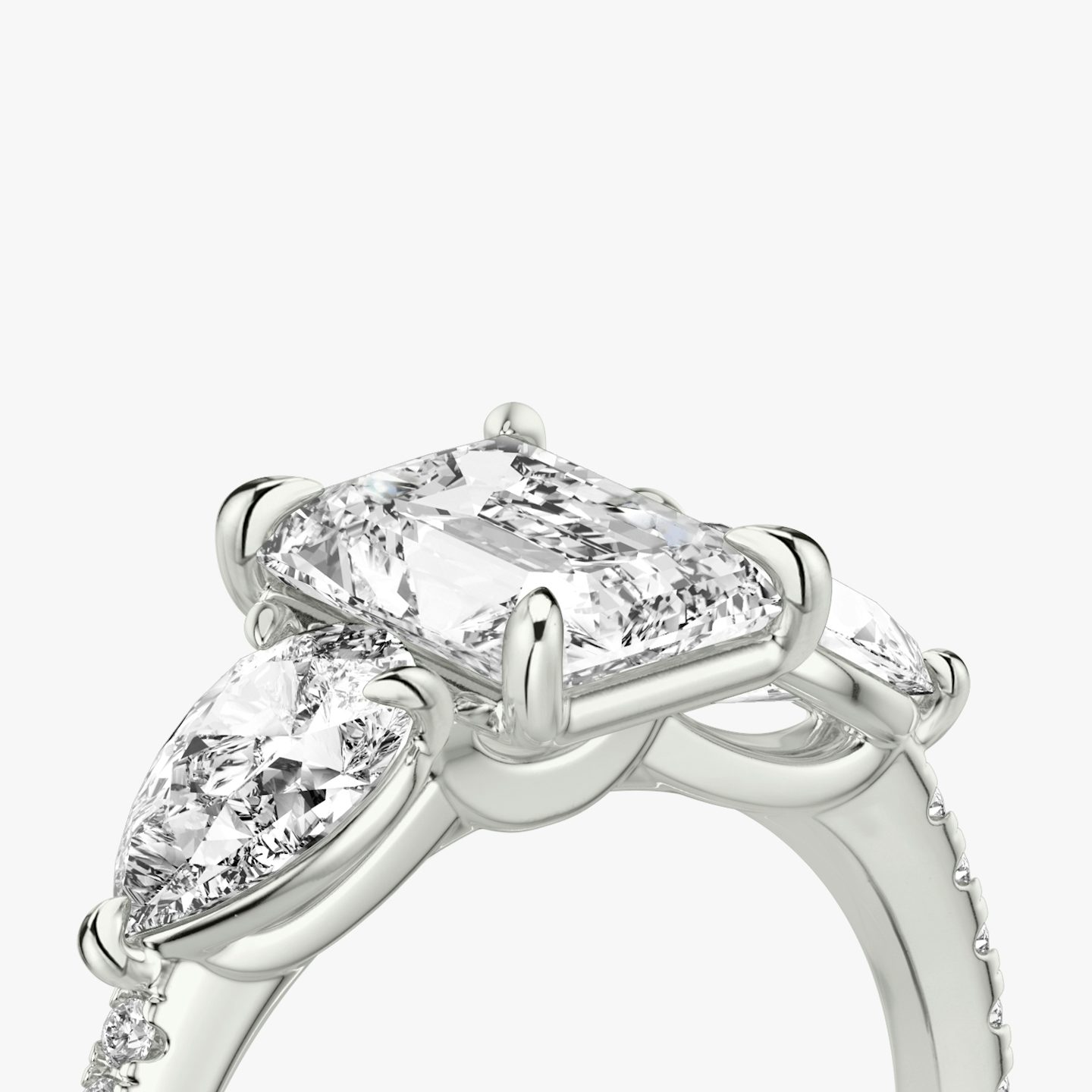 The Three Stone | Radiant | 18k | White Gold | bandAccent: Pavé | sideStoneCarat: 0.50ct | sideStoneShape: Pear | diamondOrientation: vertical | caratWeight: other
