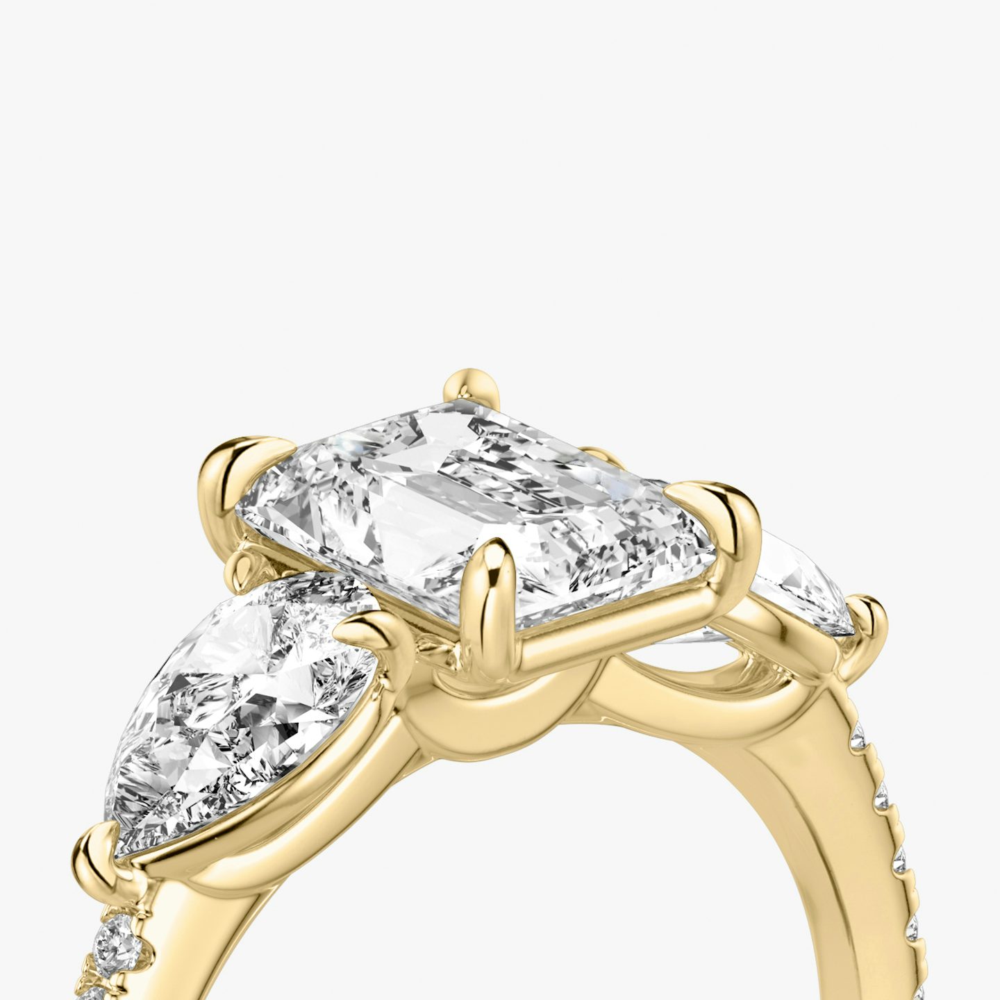 The Three Stone | Radiant | 18k | Yellow Gold | bandAccent: Pavé | sideStoneCarat: 0.50ct | sideStoneShape: Pear | diamondOrientation: vertical | caratWeight: other
