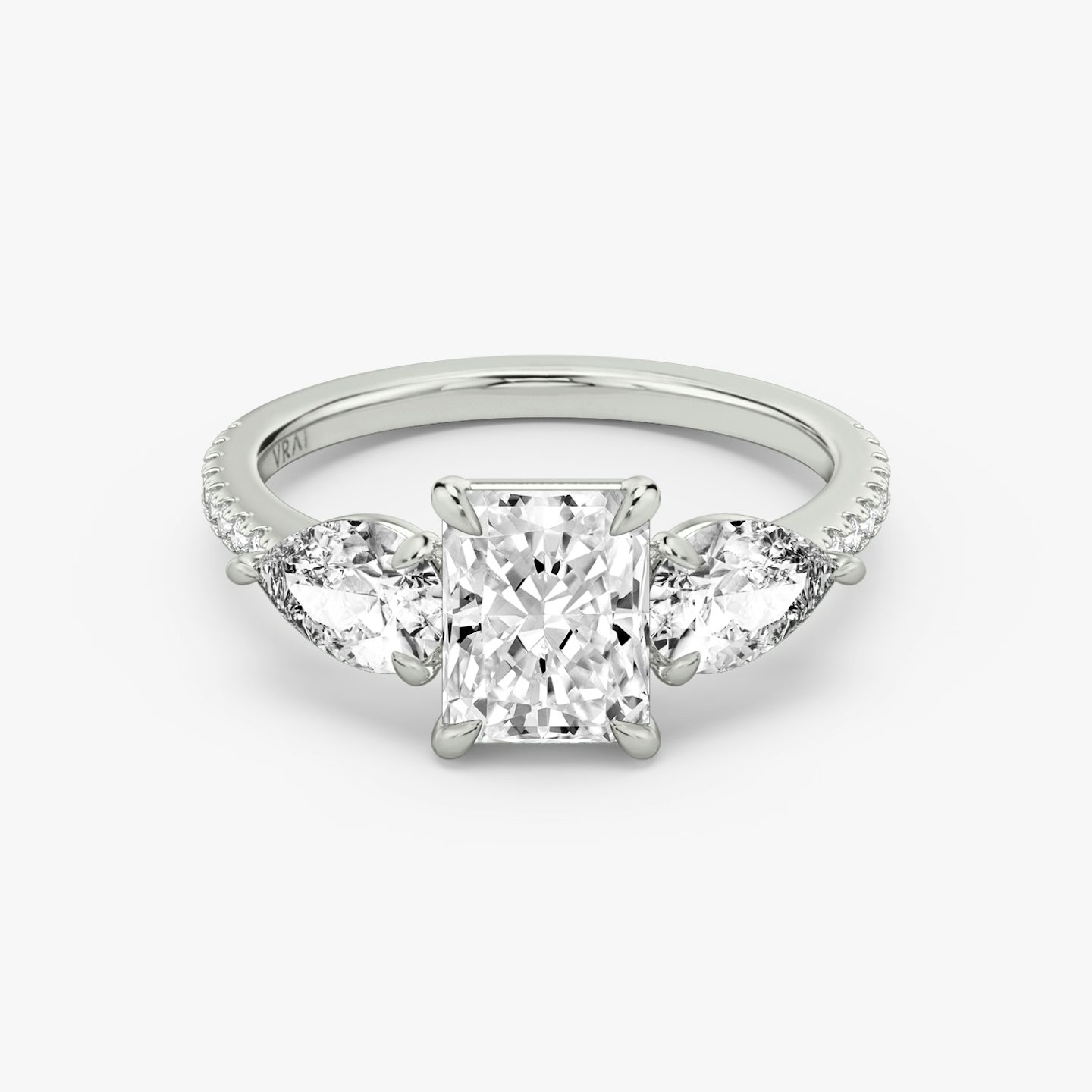 The Three Stone | Radiant | 18k | White Gold | bandAccent: Pavé | sideStoneCarat: 0.50ct | sideStoneShape: Pear | diamondOrientation: vertical | caratWeight: other