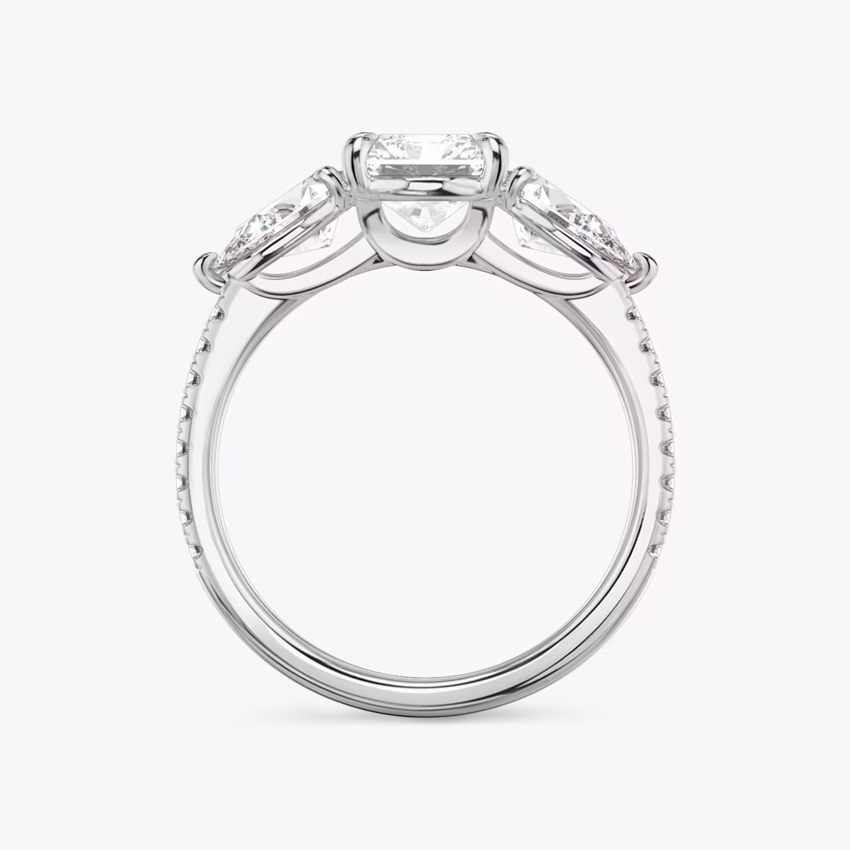 The Three Stone | Radiant | Platinum | bandAccent: Pavé | sideStoneCarat: 0.50ct | sideStoneShape: Pear | diamondOrientation: vertical | caratWeight: other