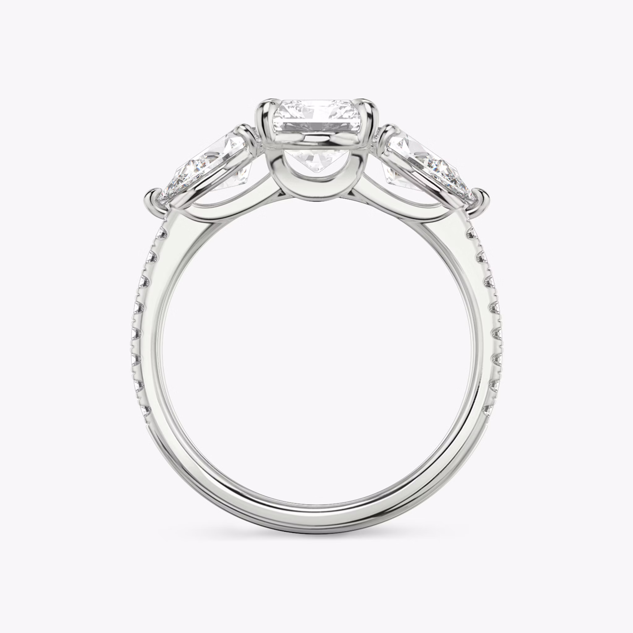 The Three Stone | Radiant | 18k | White Gold | bandAccent: Pavé | sideStoneCarat: 0.50ct | sideStoneShape: Pear | diamondOrientation: vertical | caratWeight: other