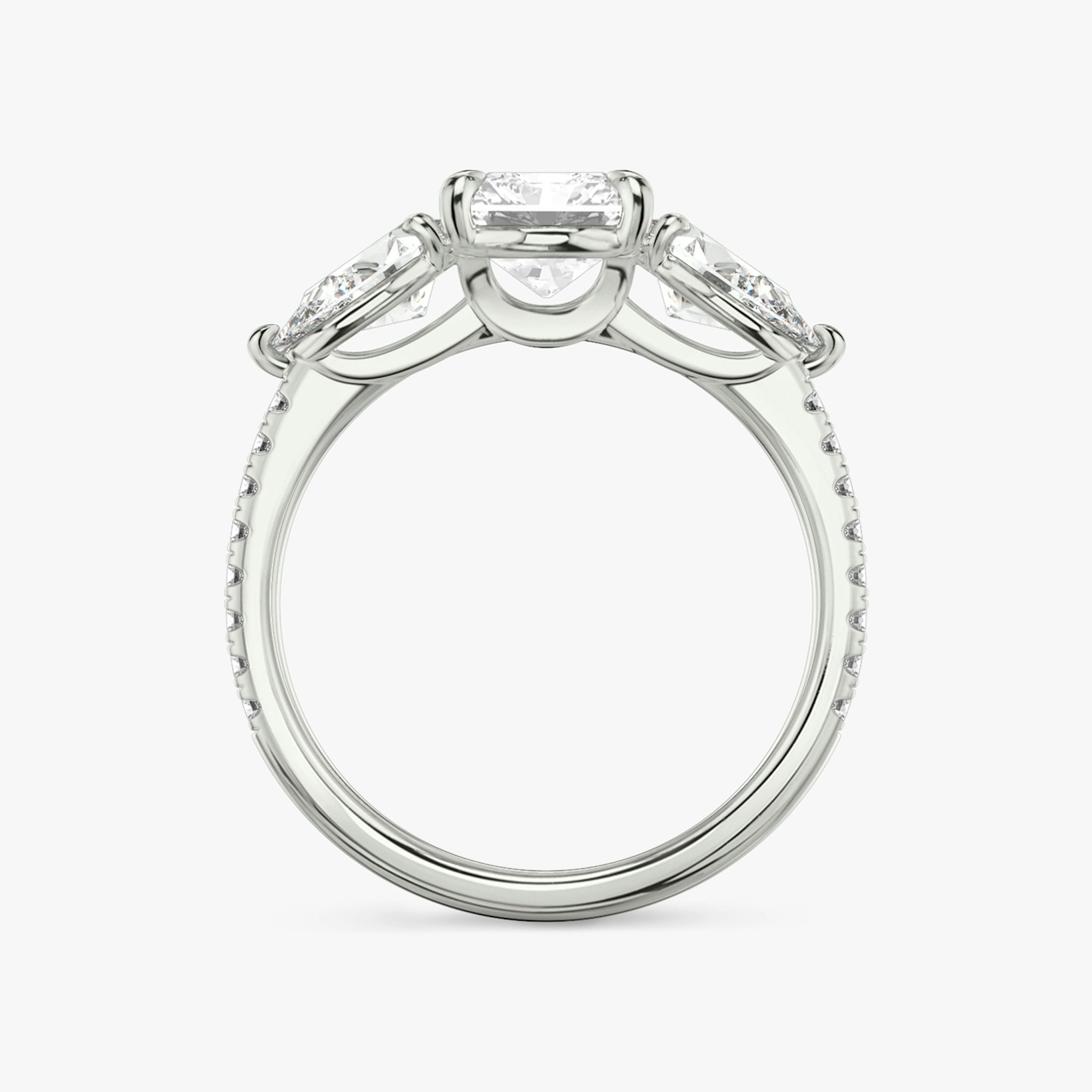 The Three Stone | Radiant | 18k | White Gold | bandAccent: Pavé | sideStoneCarat: 0.50ct | sideStoneShape: Pear | diamondOrientation: vertical | caratWeight: other
