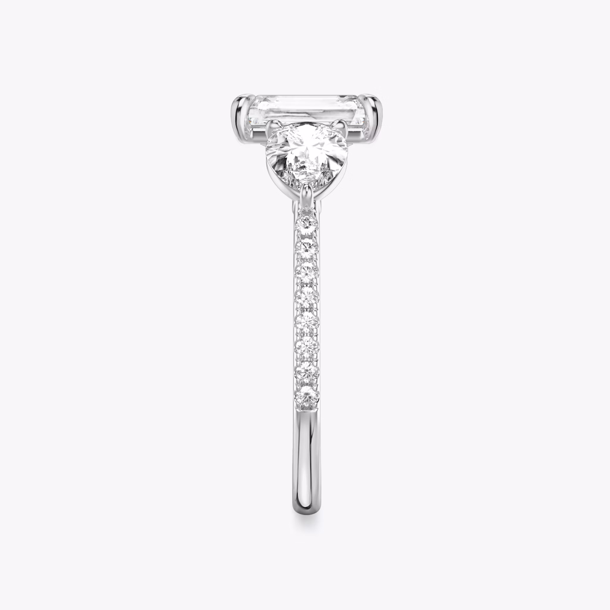 The Three Stone | Radiant | 18k | White Gold | bandAccent: Pavé | sideStoneCarat: 0.50ct | sideStoneShape: Pear | diamondOrientation: vertical | caratWeight: other