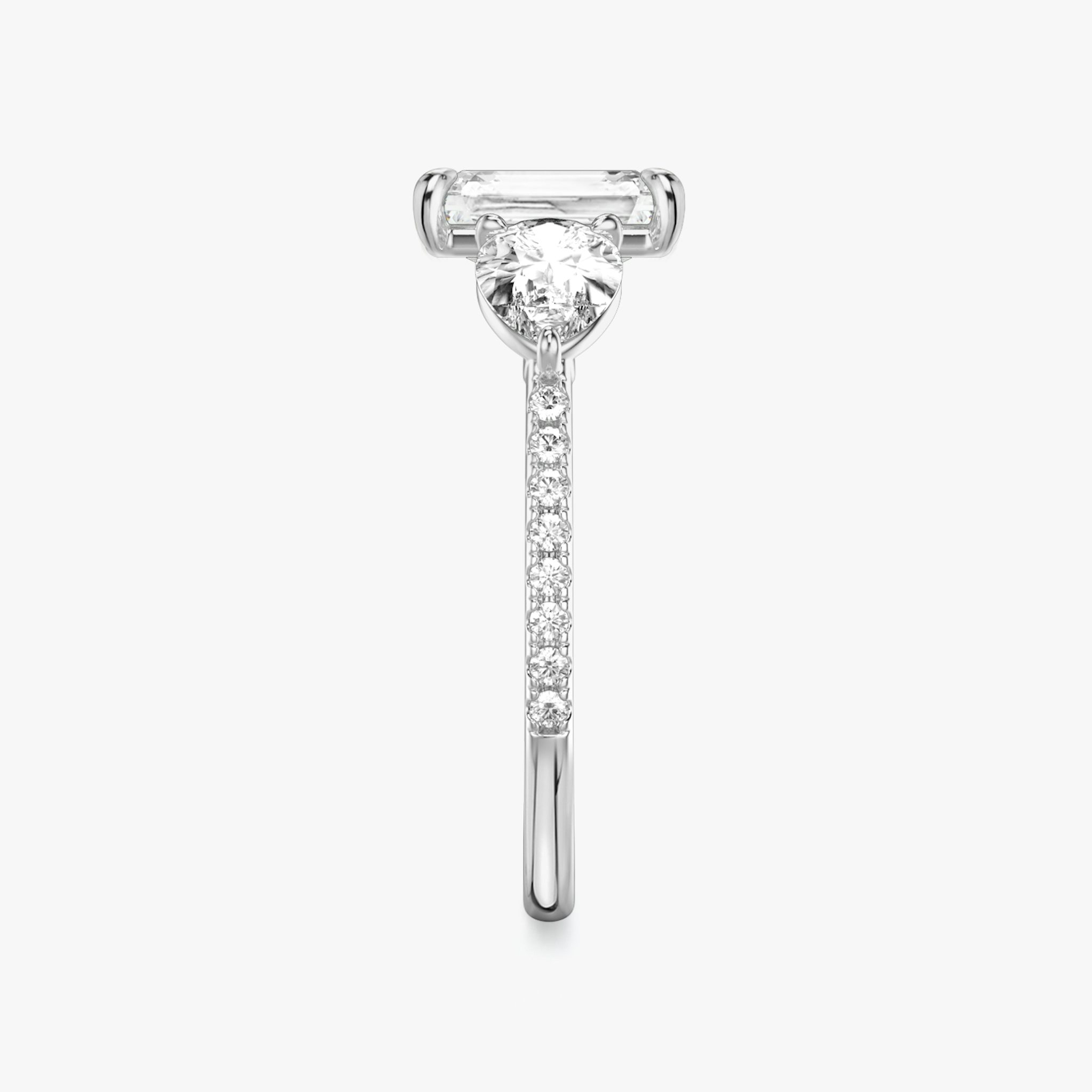 The Three Stone | Radiant | 18k | White Gold | bandAccent: Pavé | sideStoneCarat: 0.50ct | sideStoneShape: Pear | diamondOrientation: vertical | caratWeight: other