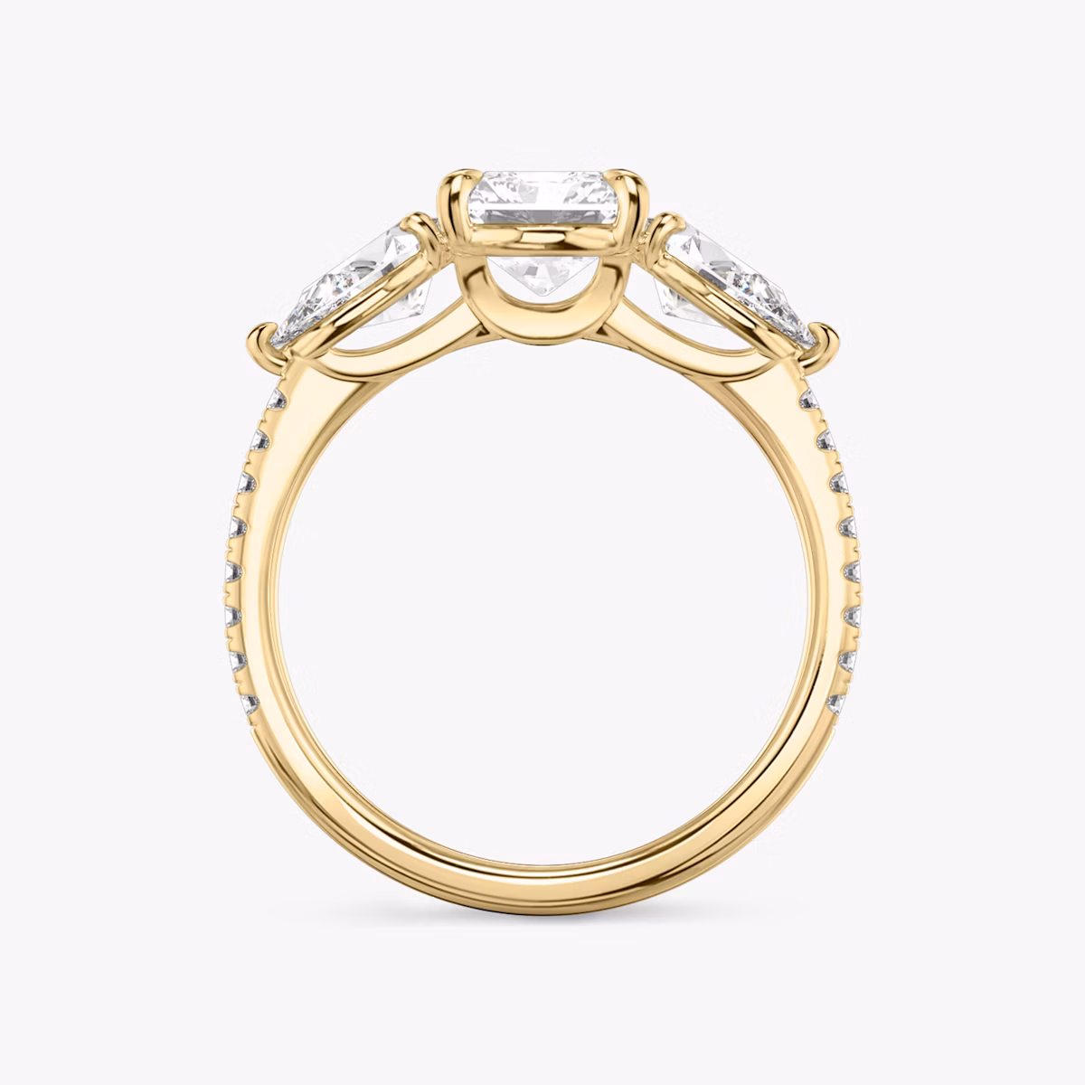 The Three Stone | Radiant | 18k | Yellow Gold | bandAccent: Pavé | sideStoneCarat: 0.50ct | sideStoneShape: Pear | diamondOrientation: vertical | caratWeight: other