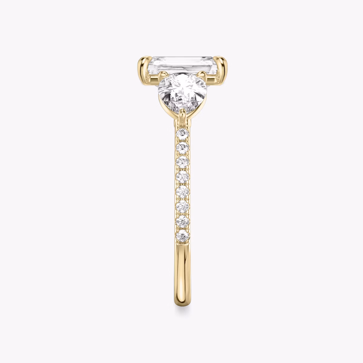 The Three Stone | Radiant | 18k | Yellow Gold | bandAccent: Pavé | sideStoneCarat: 0.50ct | sideStoneShape: Pear | diamondOrientation: vertical | caratWeight: other