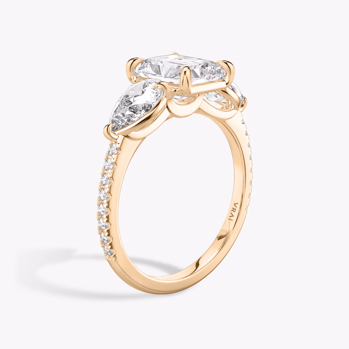 The Three Stone | Radiant | 14k | Rose Gold | bandAccent: Pavé | sideStoneCarat: 0.50ct | sideStoneShape: Pear | diamondOrientation: vertical | caratWeight: other