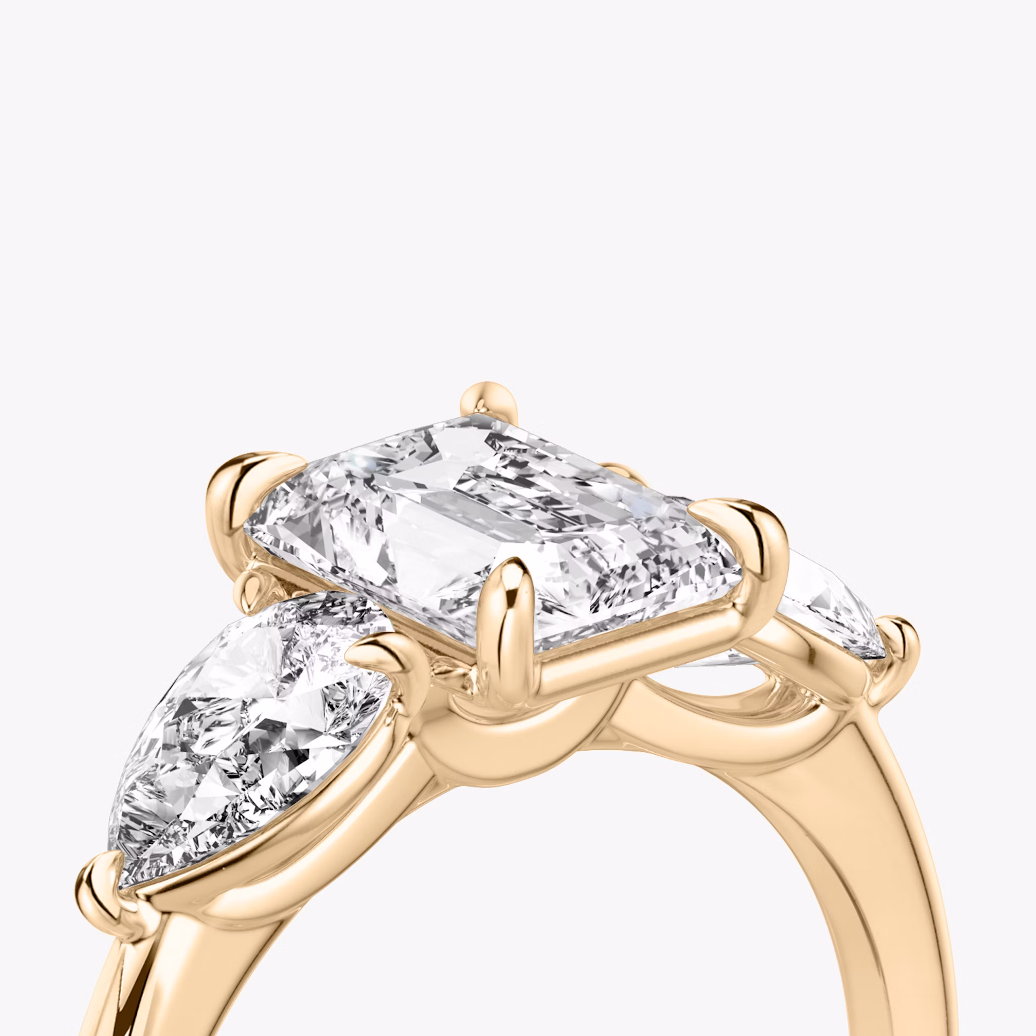 The Three Stone | Radiant | 14k | Rose Gold | bandAccent: Plain | sideStoneCarat: 0.50ct | sideStoneShape: Pear | diamondOrientation: vertical | caratWeight: other