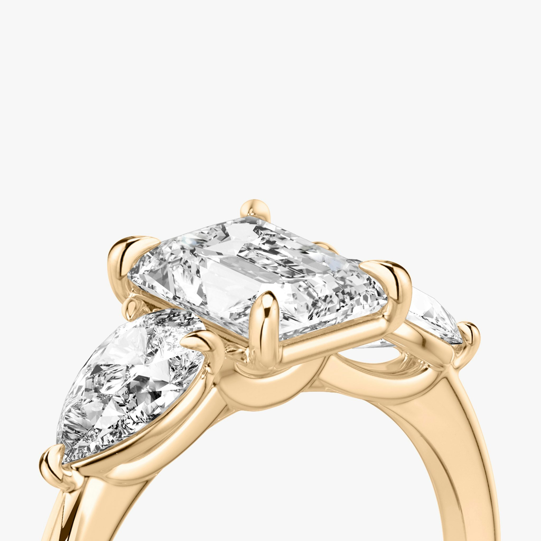The Three Stone | Radiant | 14k | Rose Gold | bandAccent: Plain | sideStoneCarat: 0.50ct | sideStoneShape: Pear | diamondOrientation: vertical | caratWeight: other