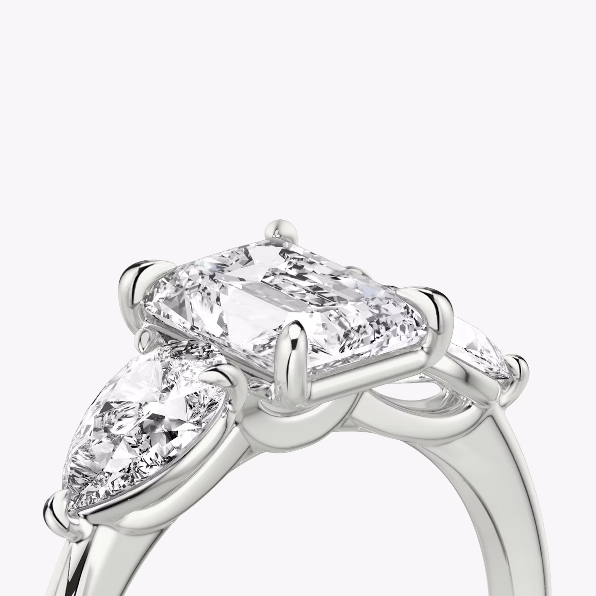 The Three Stone | Radiant | 18k | White Gold | bandAccent: Plain | sideStoneCarat: 0.50ct | sideStoneShape: Pear | diamondOrientation: vertical | caratWeight: other