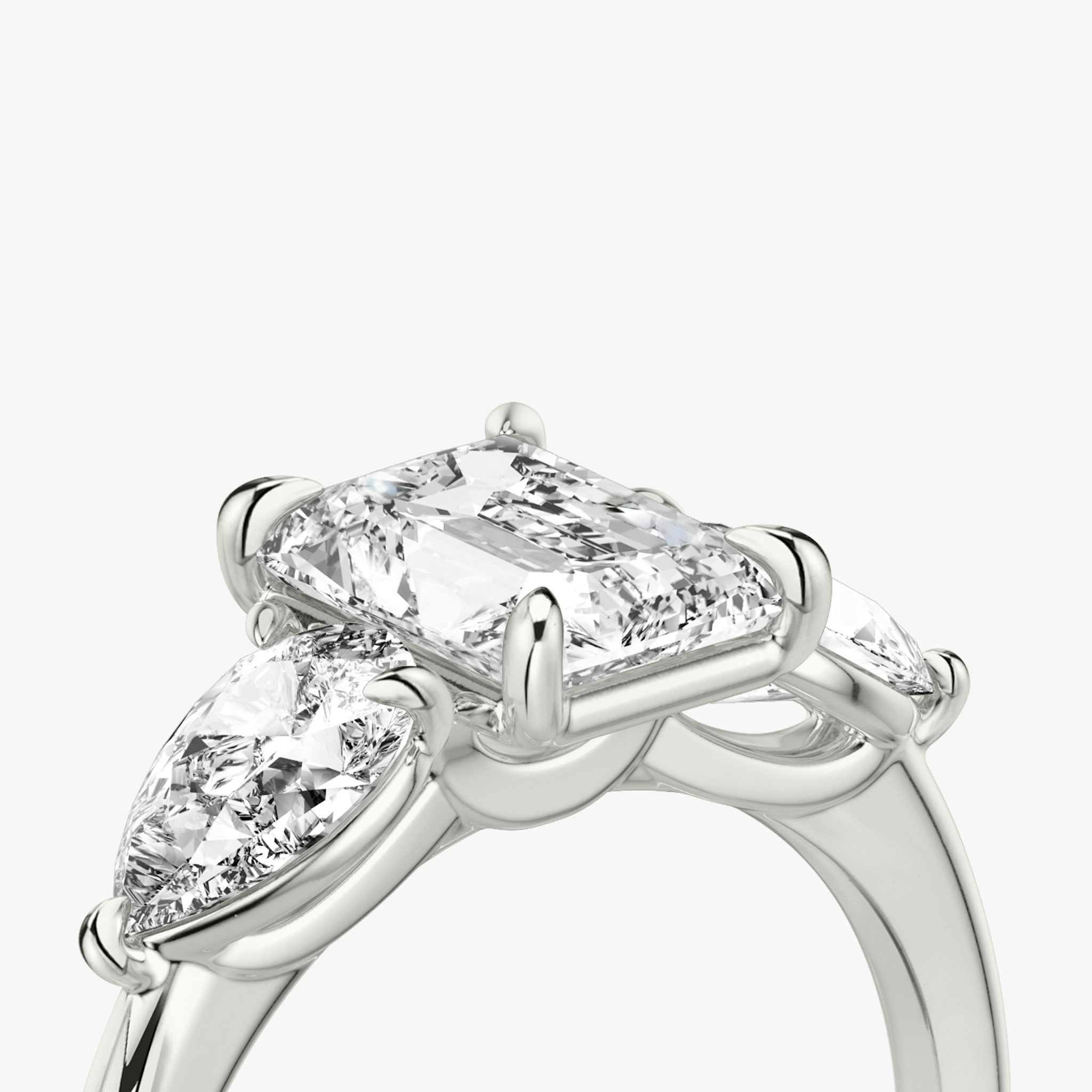 The Three Stone | Radiant | 18k | White Gold | bandAccent: Plain | sideStoneCarat: 0.50ct | sideStoneShape: Pear | diamondOrientation: vertical | caratWeight: other