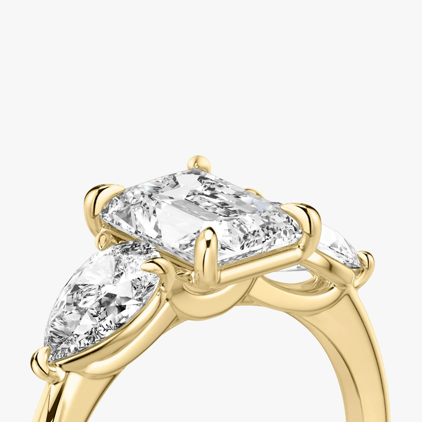 The Three Stone | Radiant | 18k | Yellow Gold | bandAccent: Plain | sideStoneCarat: 0.50ct | sideStoneShape: Pear | diamondOrientation: vertical | caratWeight: other