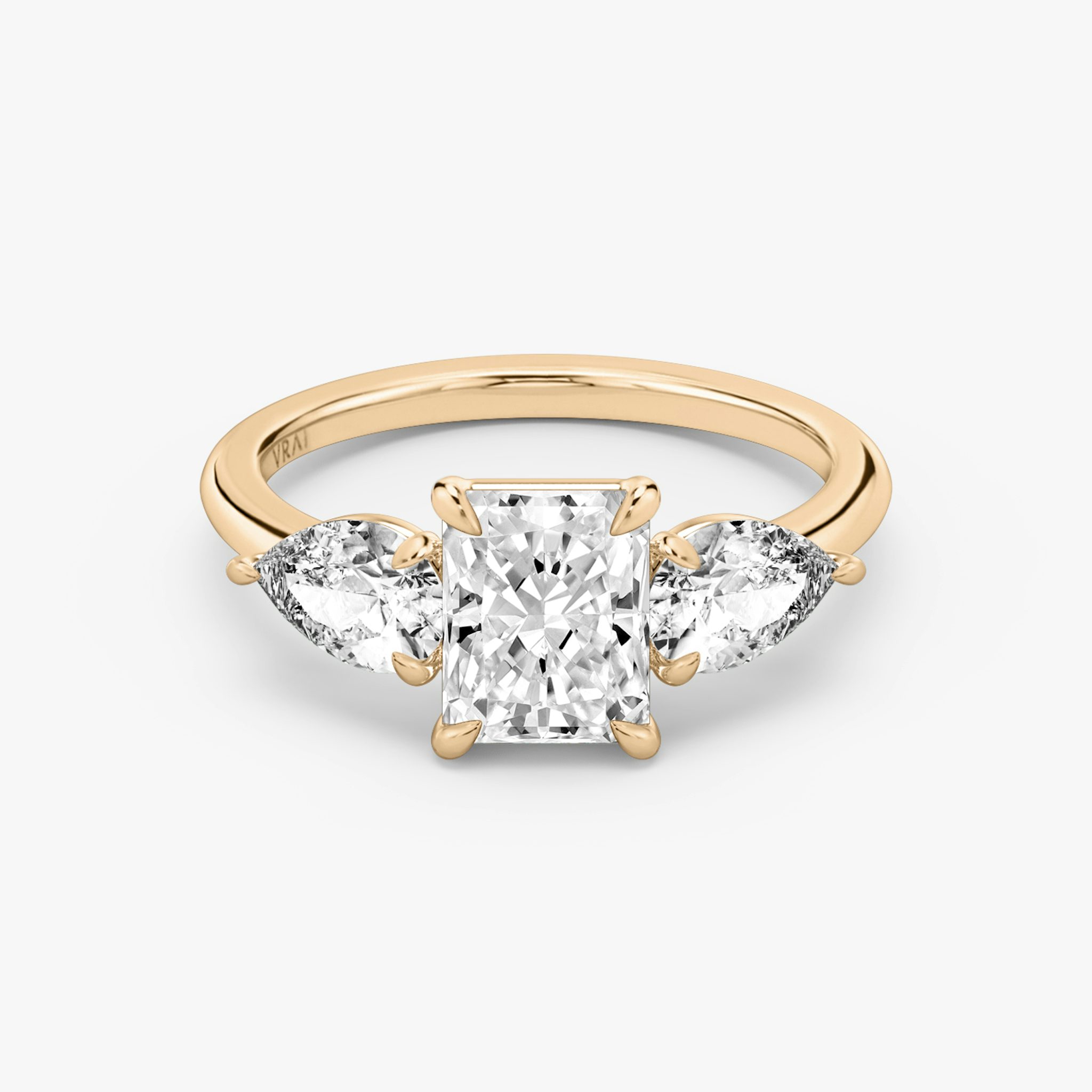 The Three Stone | Radiant | 14k | Rose Gold | bandAccent: Plain | sideStoneCarat: 0.50ct | sideStoneShape: Pear | diamondOrientation: vertical | caratWeight: other