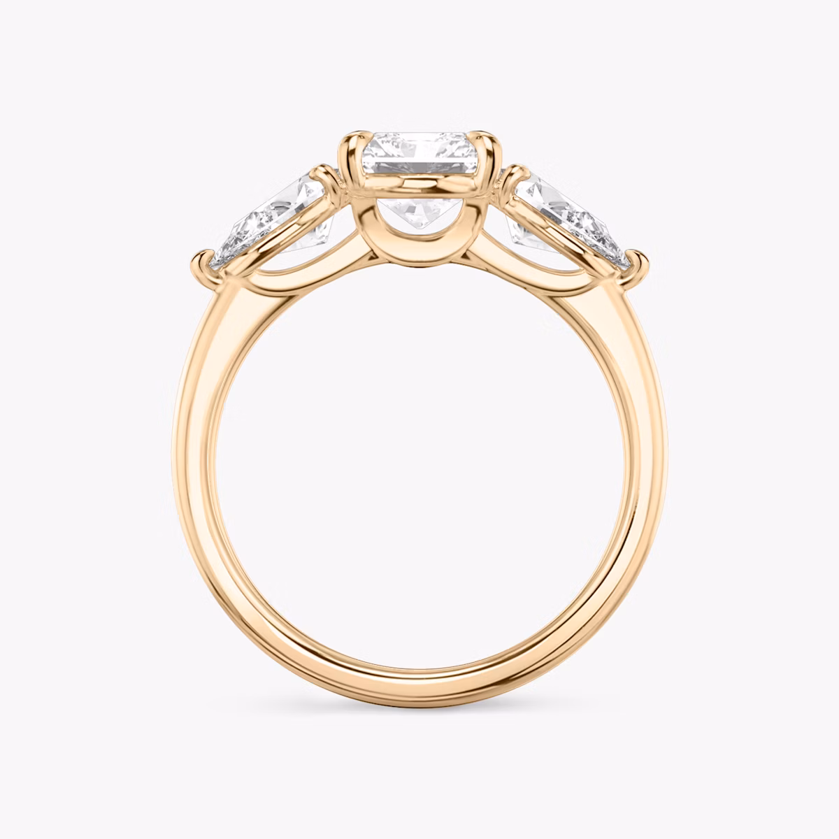 The Three Stone | Radiant | 14k | Rose Gold | bandAccent: Plain | sideStoneCarat: 0.50ct | sideStoneShape: Pear | diamondOrientation: vertical | caratWeight: other