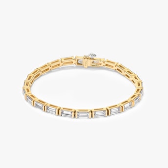 The Baguette Tennis Bracelet in yellow gold.