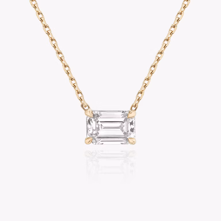 The Solitaire Emerald Necklace in yellow gold.