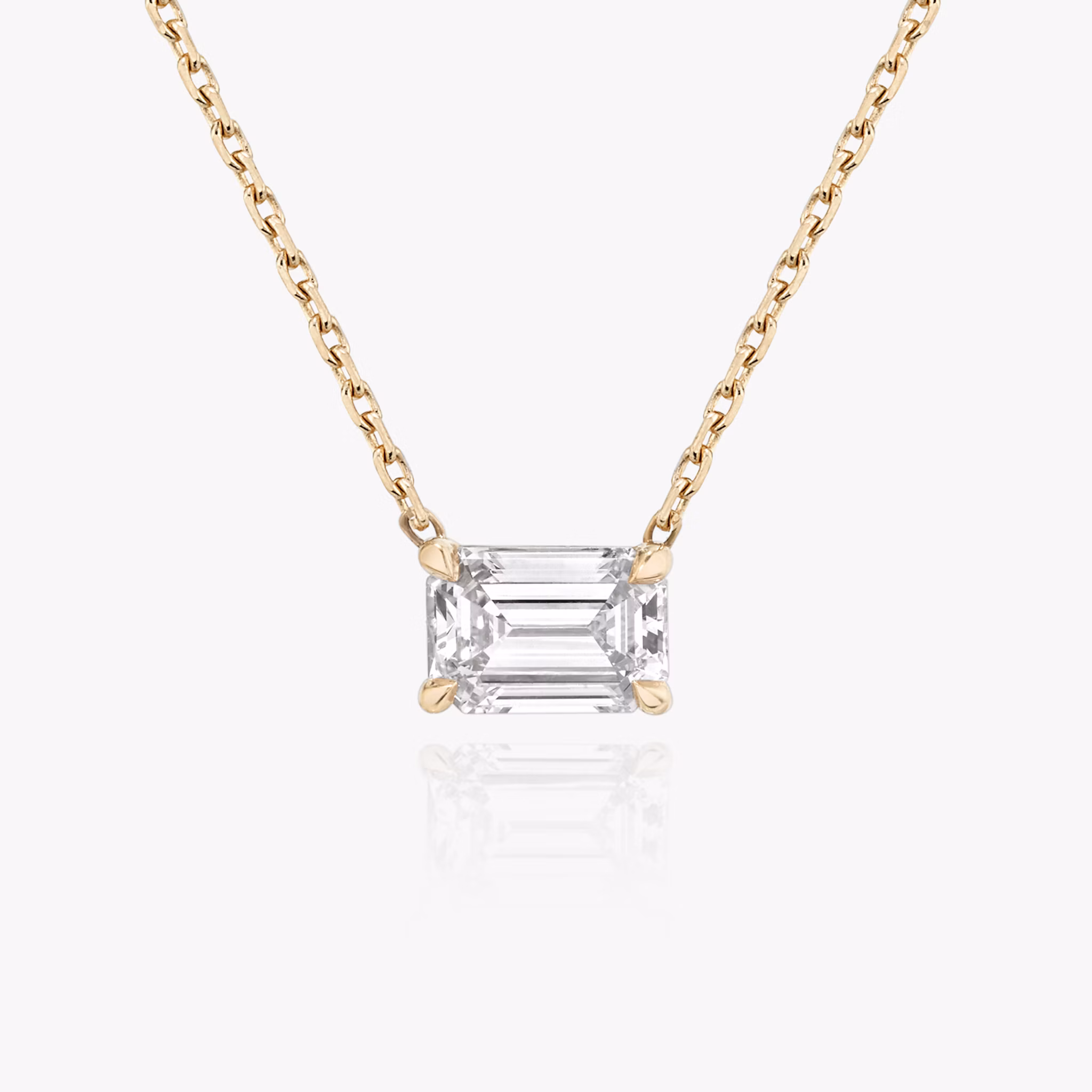 The Solitaire Emerald Necklace in yellow gold.