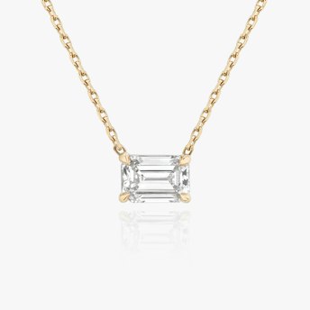 The Solitaire Emerald Necklace in yellow gold.