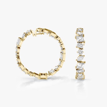 A pair of Illuminate Hoops in gold.