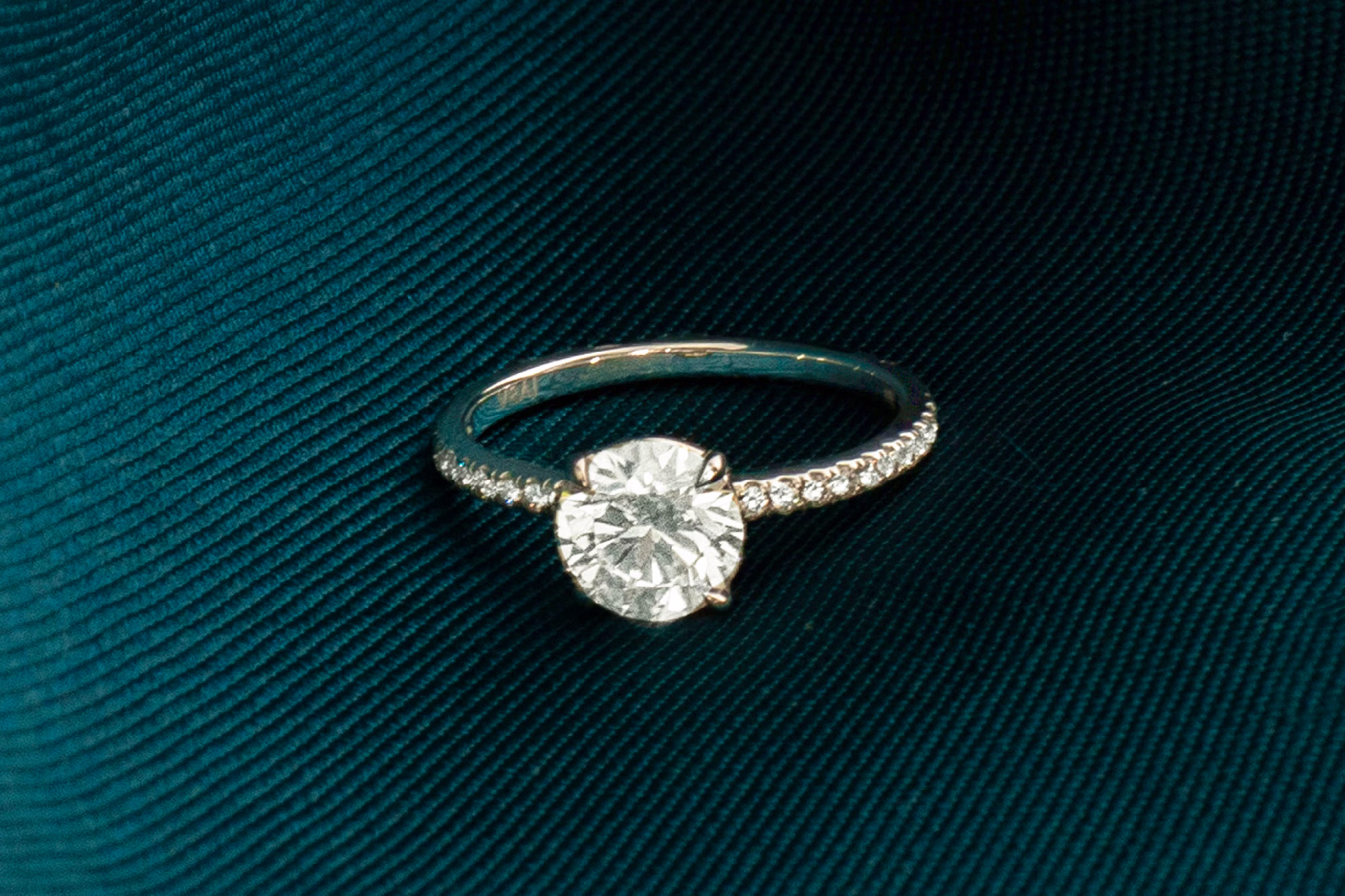 The round brilliant signature engagement ring with pave band