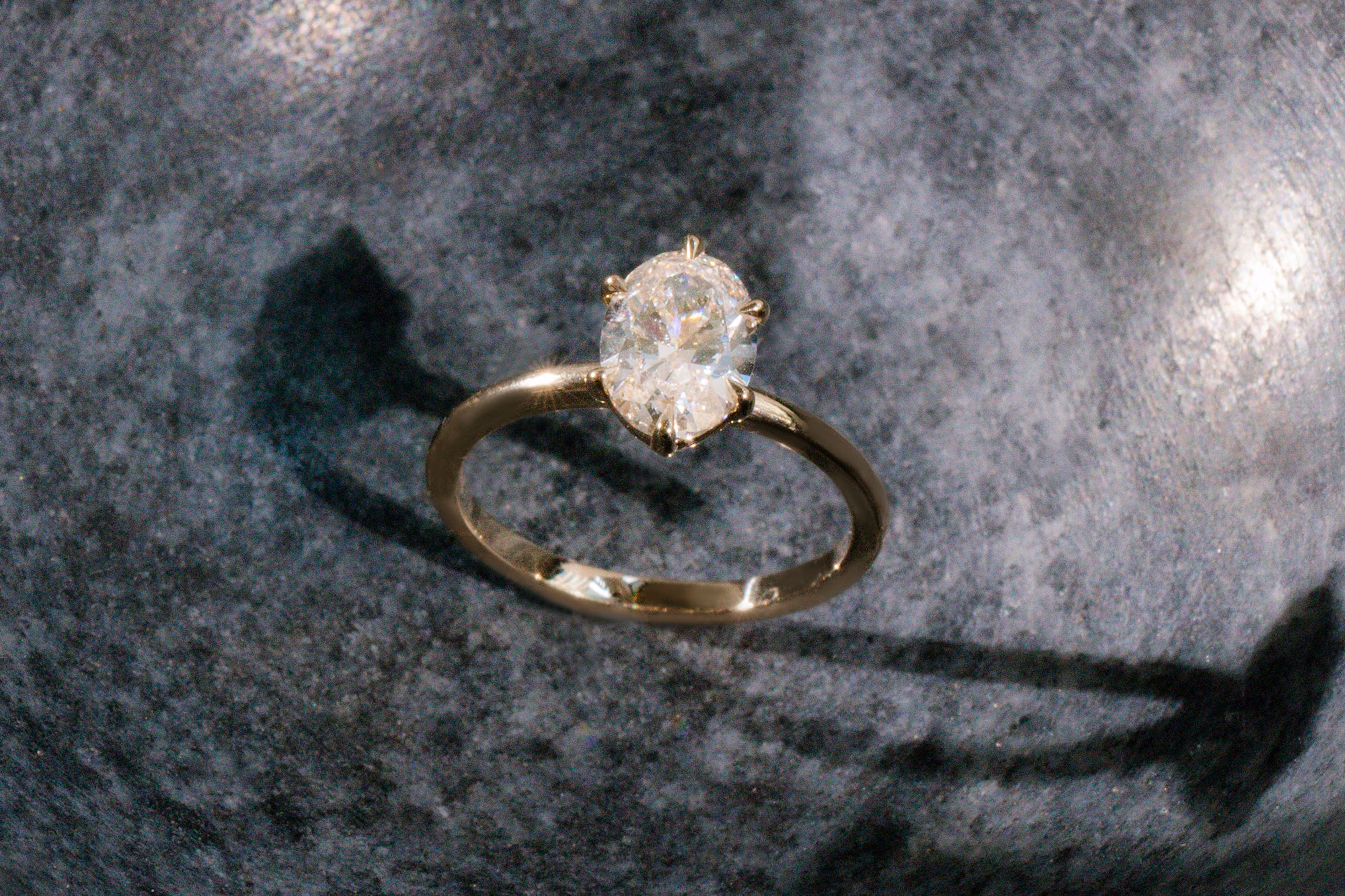 The oval signature 6 prong with yellow gold band