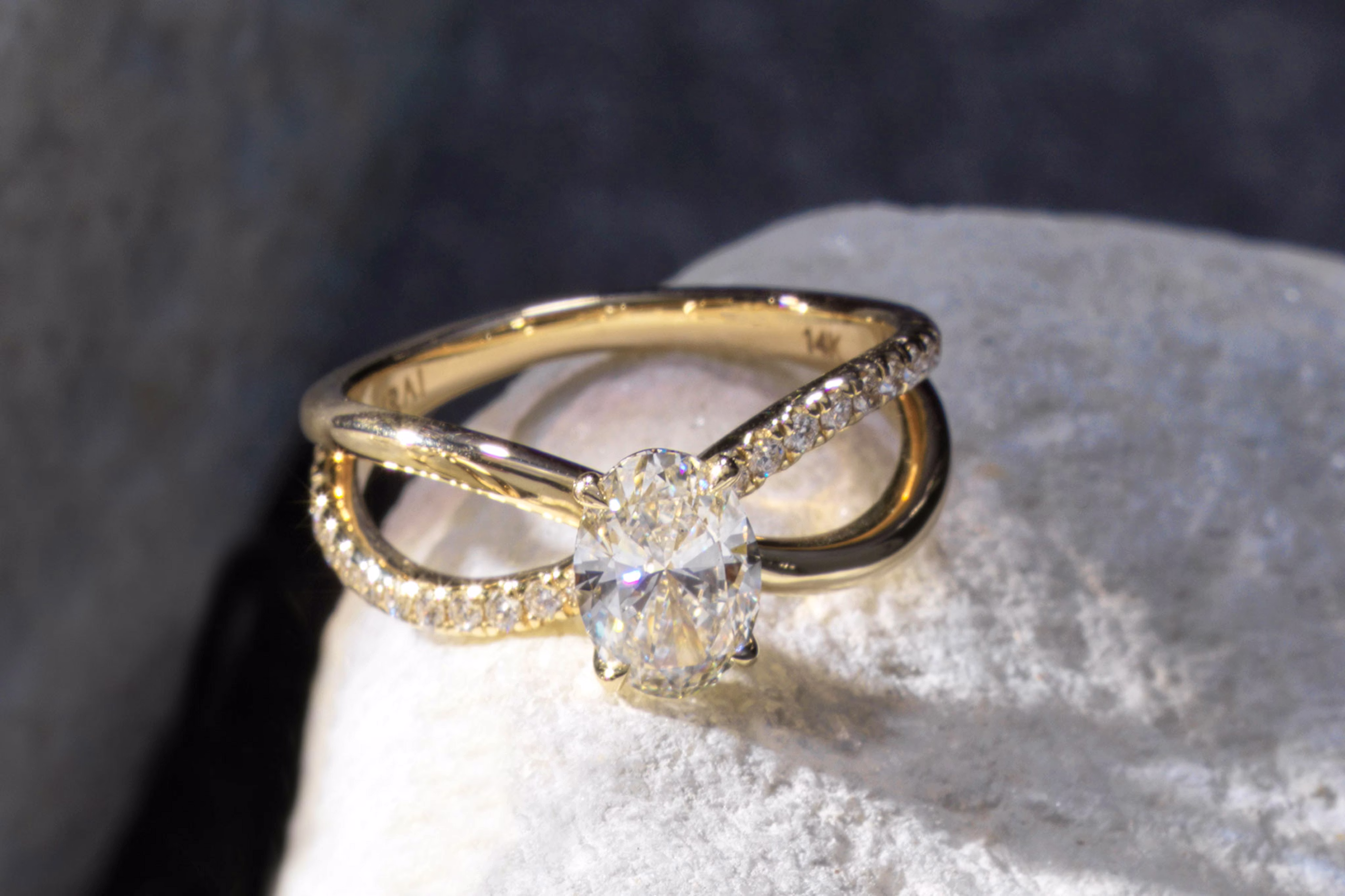 The oval duet engagement ring with yellow gold pave band