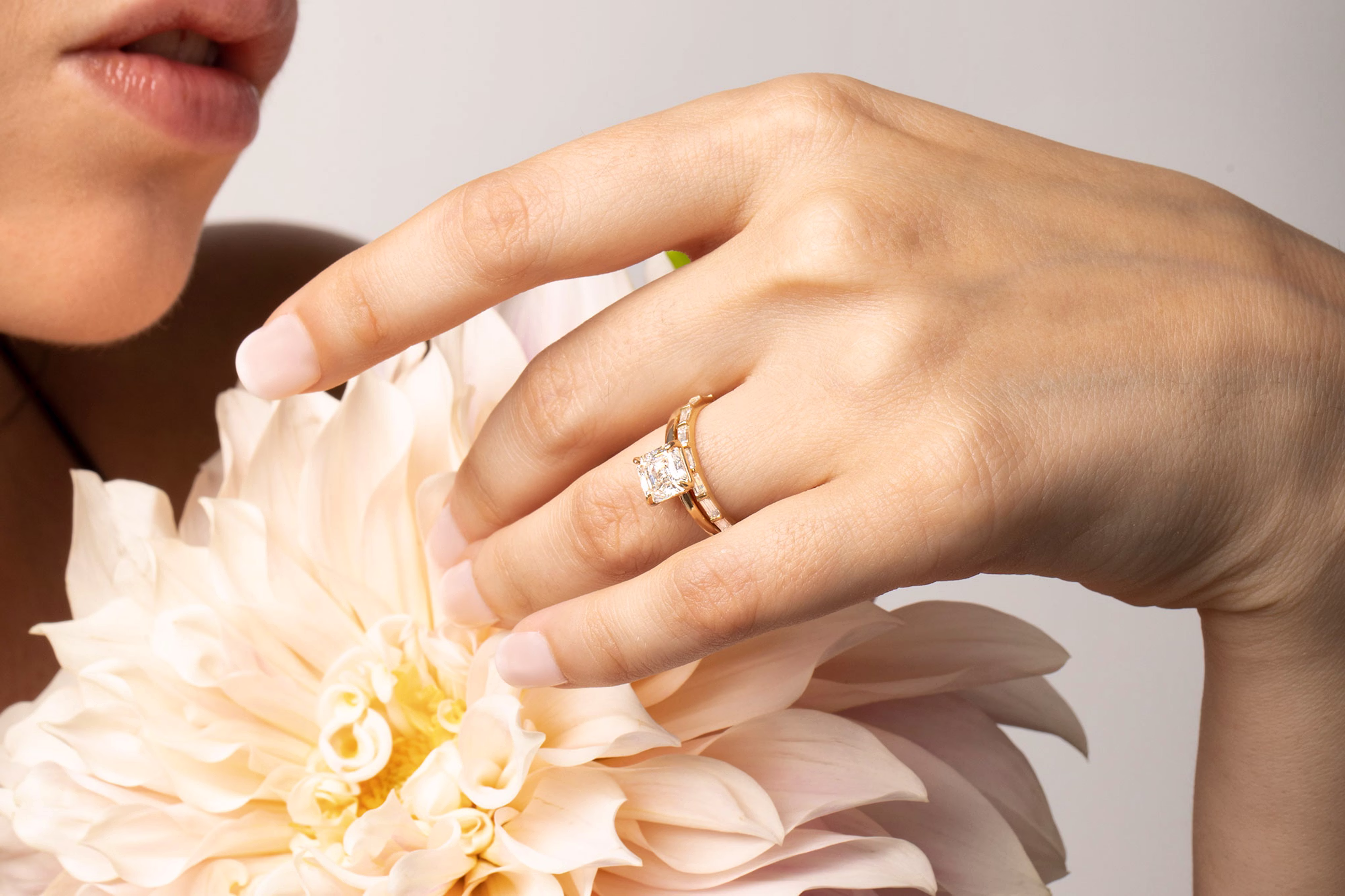 The signature asscher engagement ring with yellow gold band