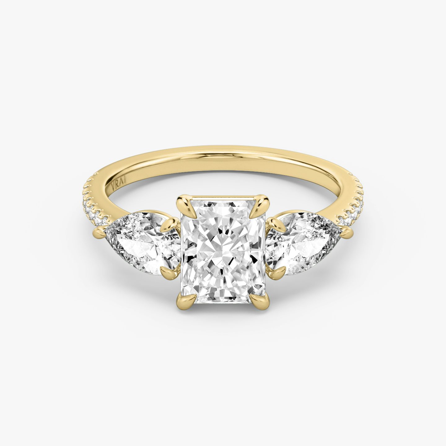 The Three Stone | Radiant | 18k | Yellow Gold | bandAccent: Pavé | sideStoneCarat: 0.50ct | sideStoneShape: Pear | diamondOrientation: vertical | caratWeight: other