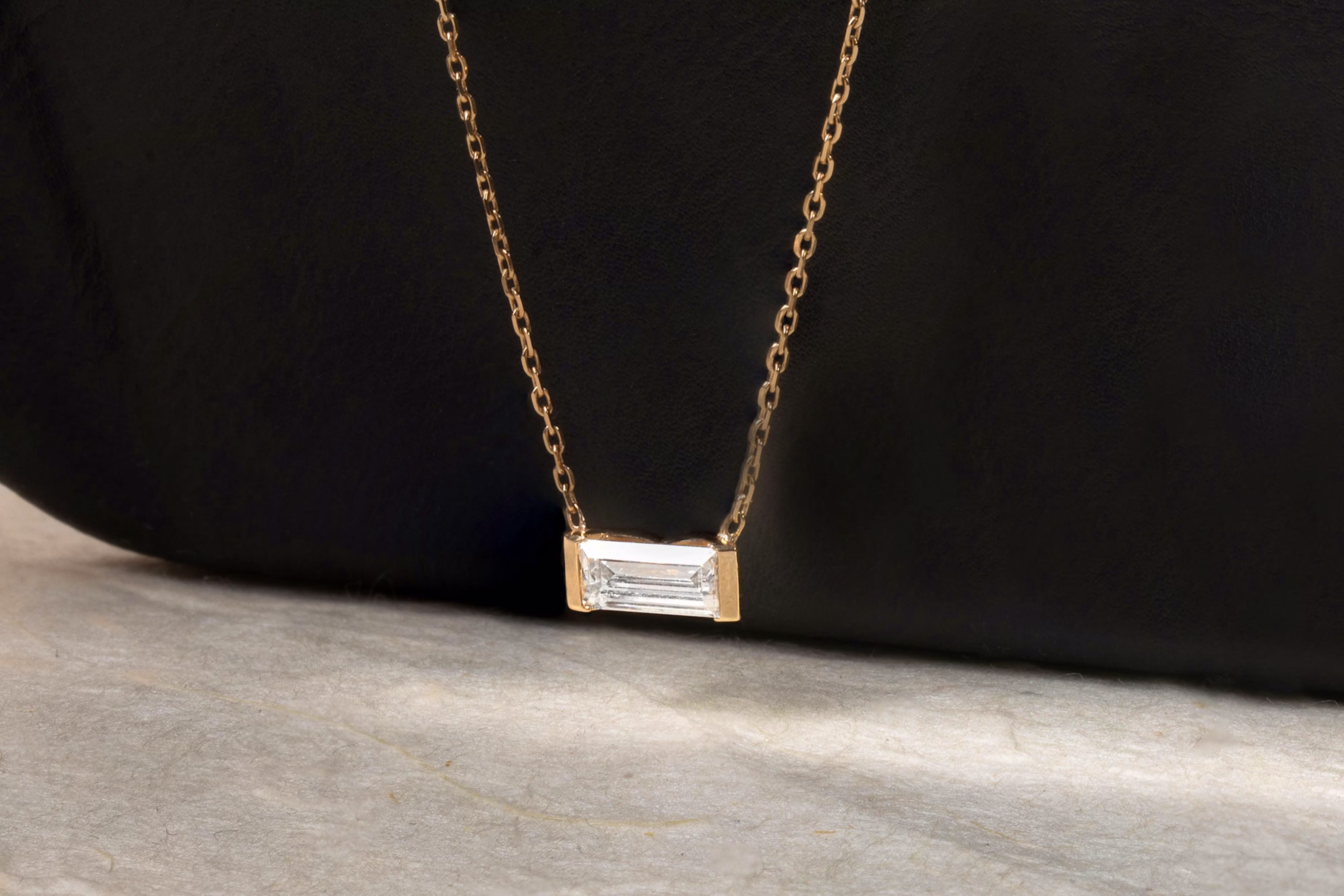 Yellow gold baguette semi-bezel necklace