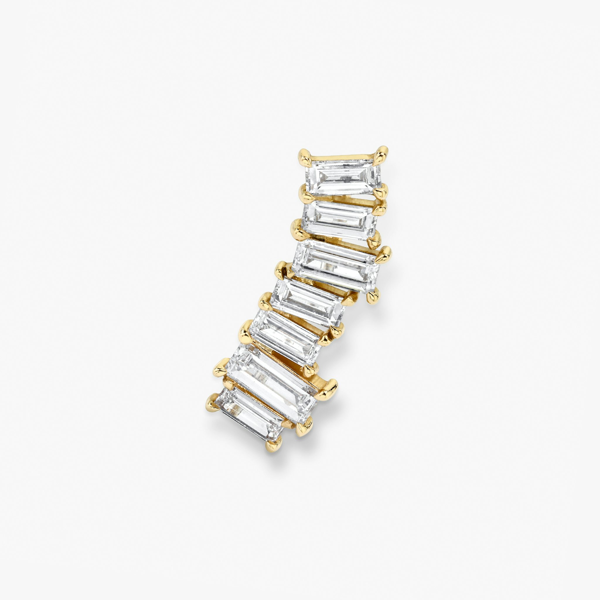 Ear arc made out of solid yellow gold and 7 baguette shaped diamonds