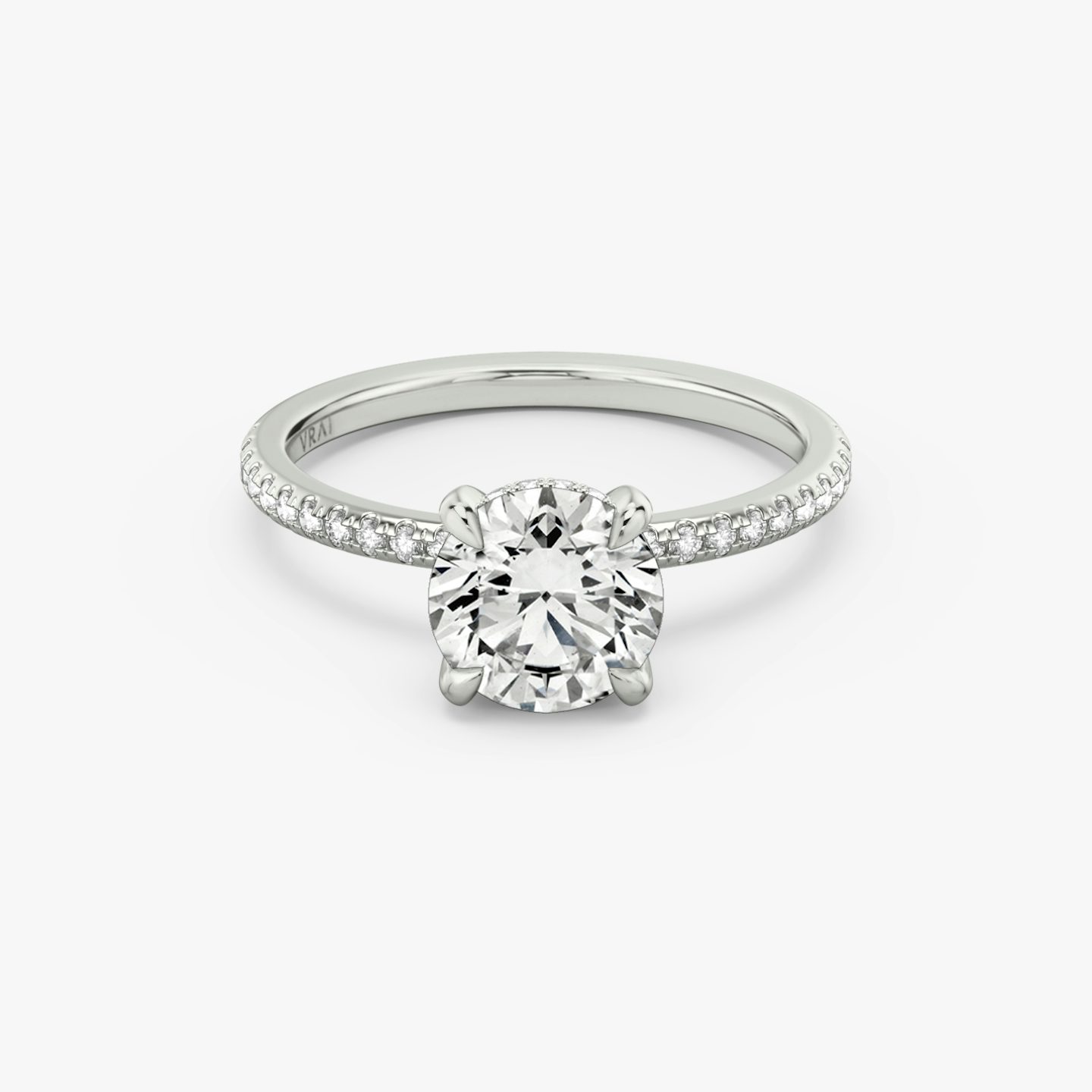 The Classic Hidden Halo | Round Brilliant | Platinum | bandAccent: Pavé | bandWidth: standard | caratWeight: other | prongStyle: Plain | diamondOrientation: vertical