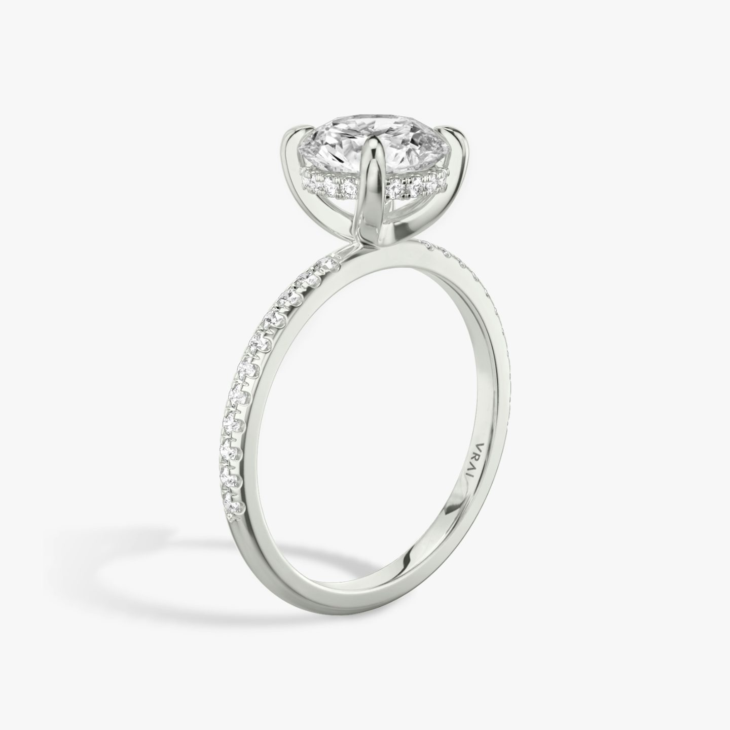 The Classic Hidden Halo | Round Brilliant | Platinum | bandAccent: Pavé | bandWidth: standard | caratWeight: other | prongStyle: Plain | diamondOrientation: vertical