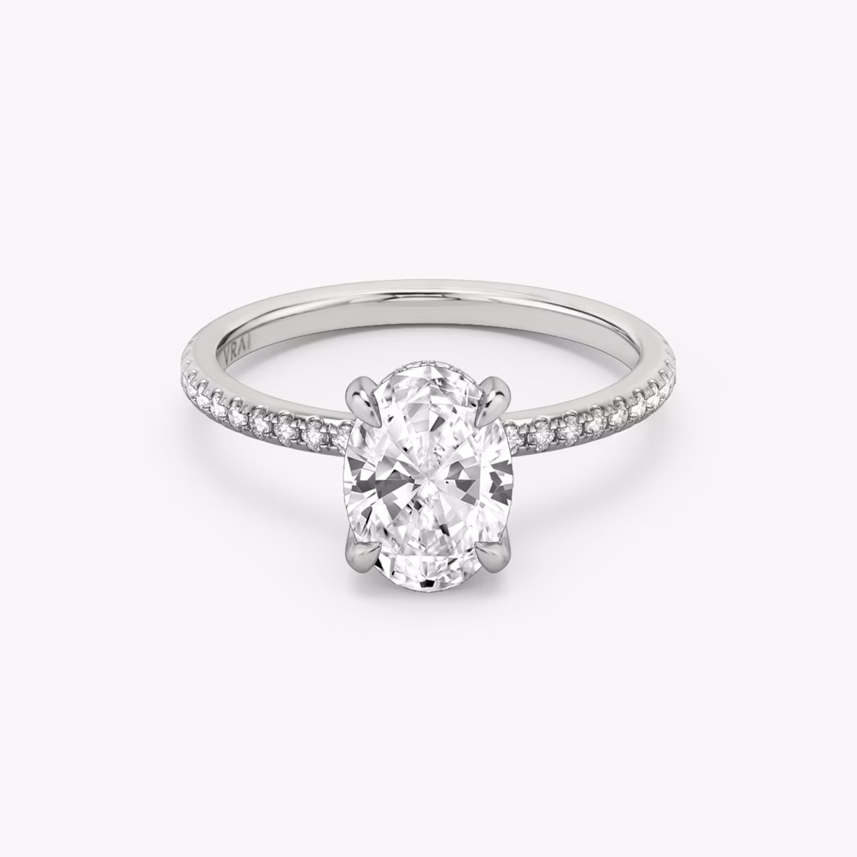 The Classic Hidden Halo | Oval | Platinum | bandAccent: Pavé | bandWidth: standard | prongStyle: Plain | diamondOrientation: vertical | caratWeight: other