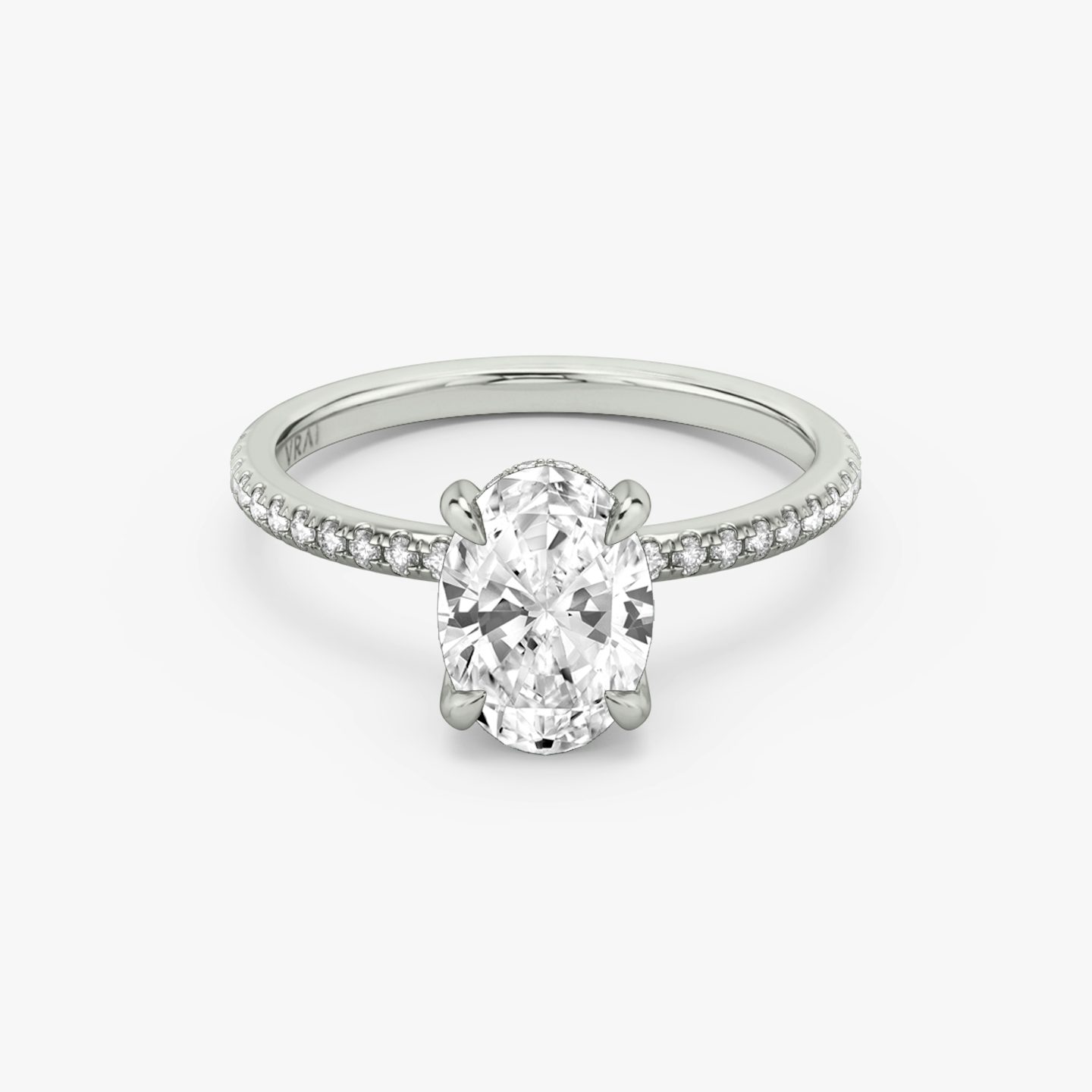 The Classic Hidden Halo | Oval | Platinum | bandAccent: Pavé | bandWidth: standard | prongStyle: Plain | diamondOrientation: vertical | caratWeight: other
