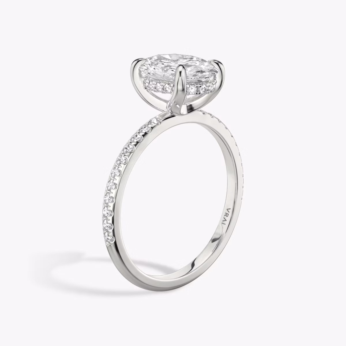 The Classic Hidden Halo | Oval | Platinum | bandAccent: Pavé | bandWidth: standard | prongStyle: Plain | diamondOrientation: vertical | caratWeight: other