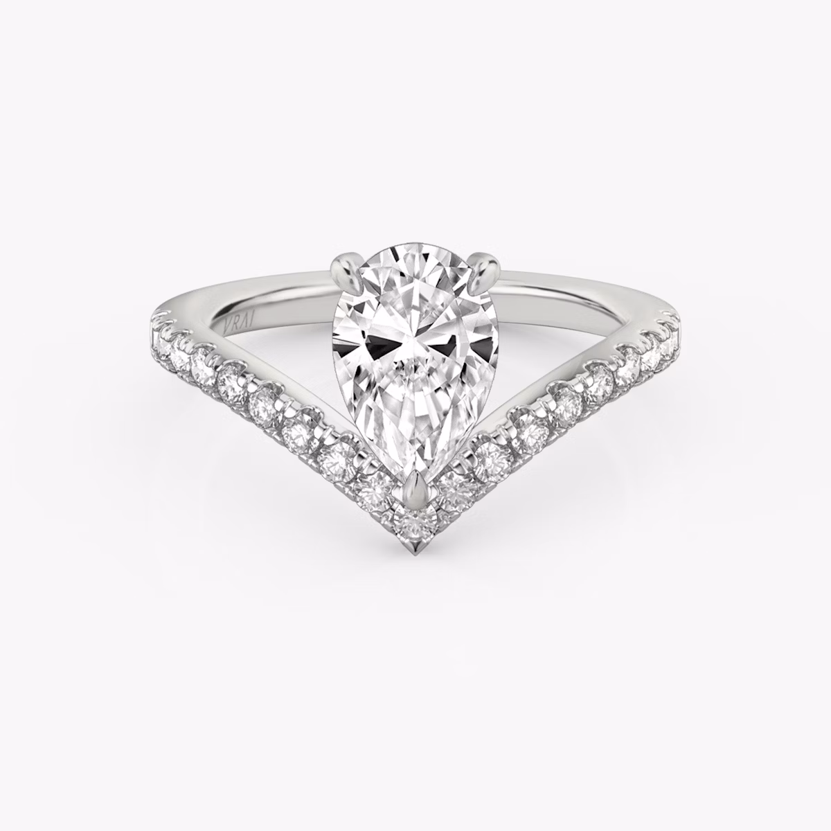 Signature V-ring with a pear-cut center stone and pavé-set accents, crafted in white gold, shown on white background.