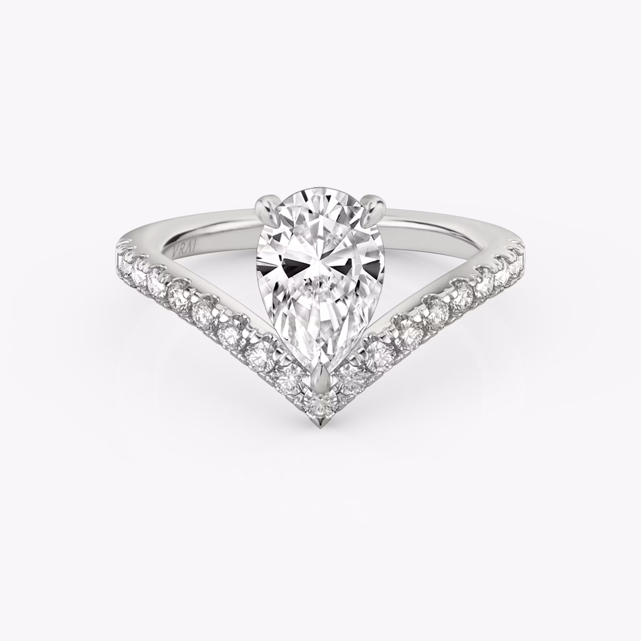 Signature V-ring with a pear-cut center stone and pavé-set accents, crafted in white gold, shown on white background.