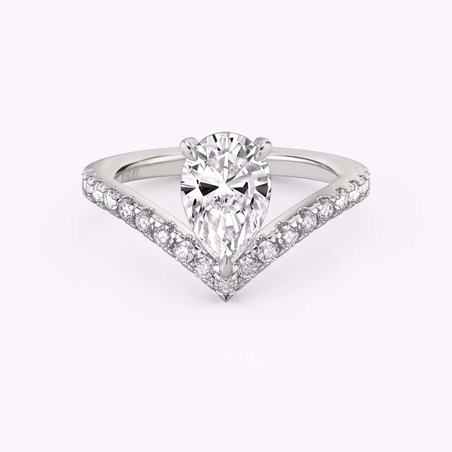 Signature V-ring with a pear-cut center stone and pavé-set accents, crafted in white gold, shown on white background.