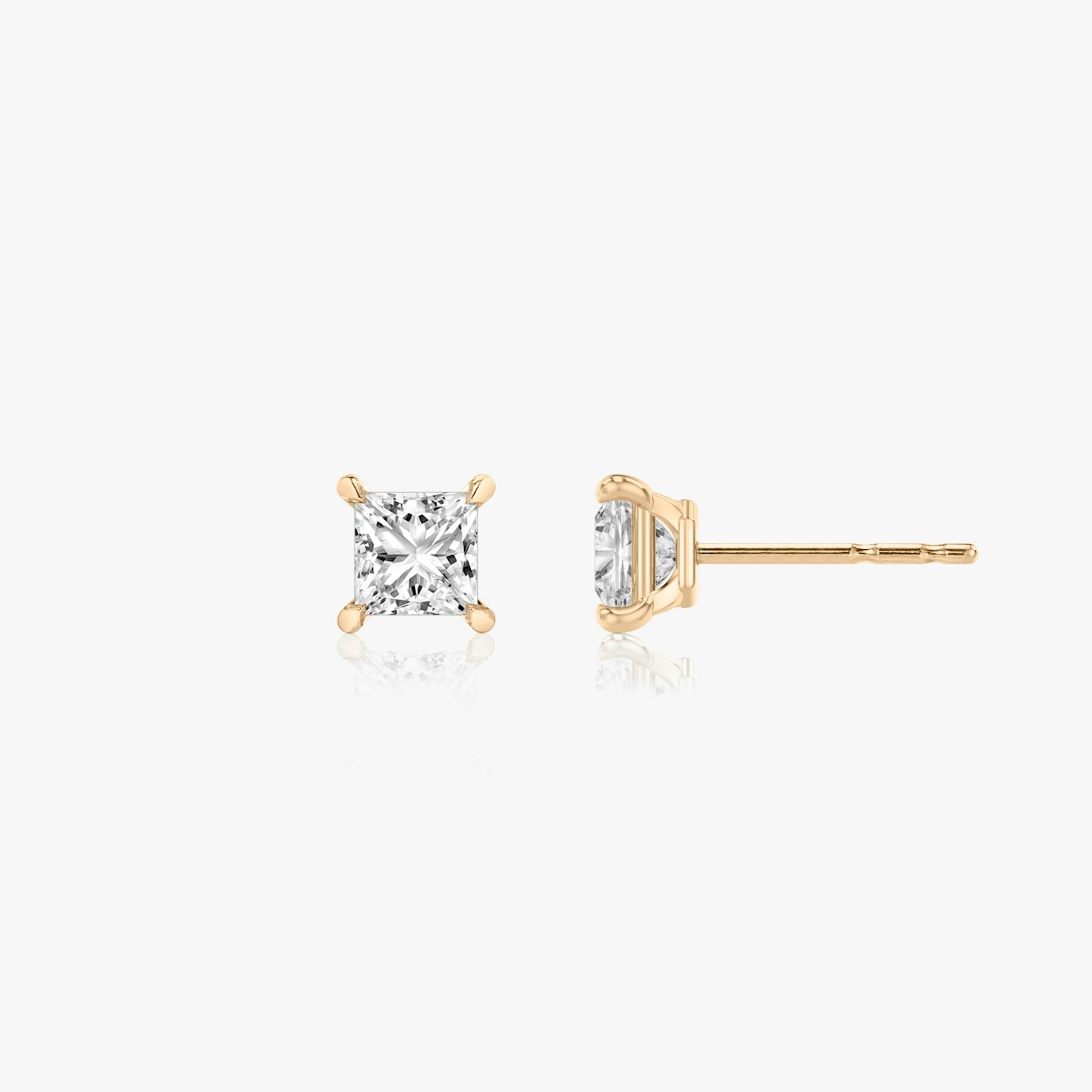 Two studs with a princess cut diamond in rose gold side view