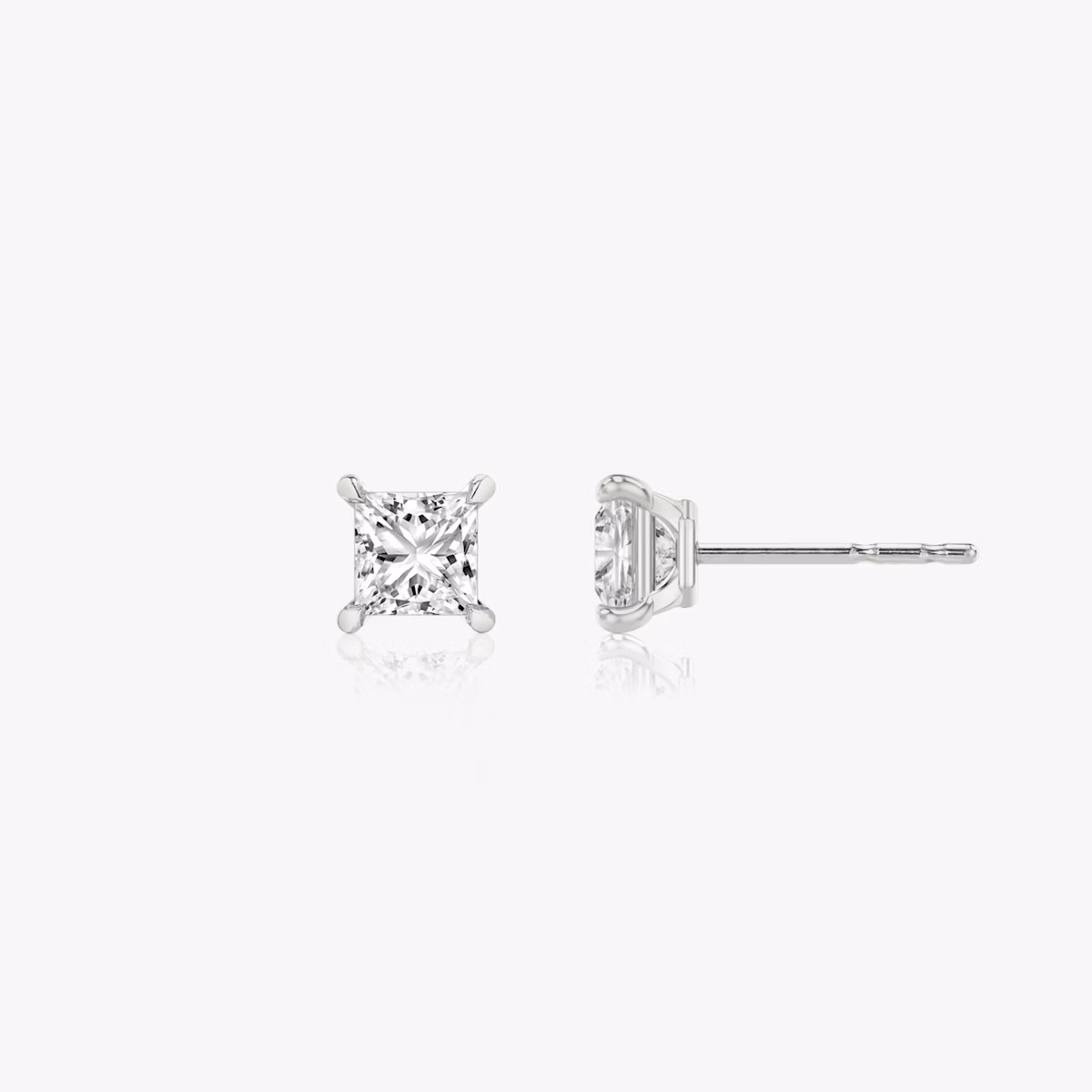 Two studs with a princess cut diamond in white gold side view