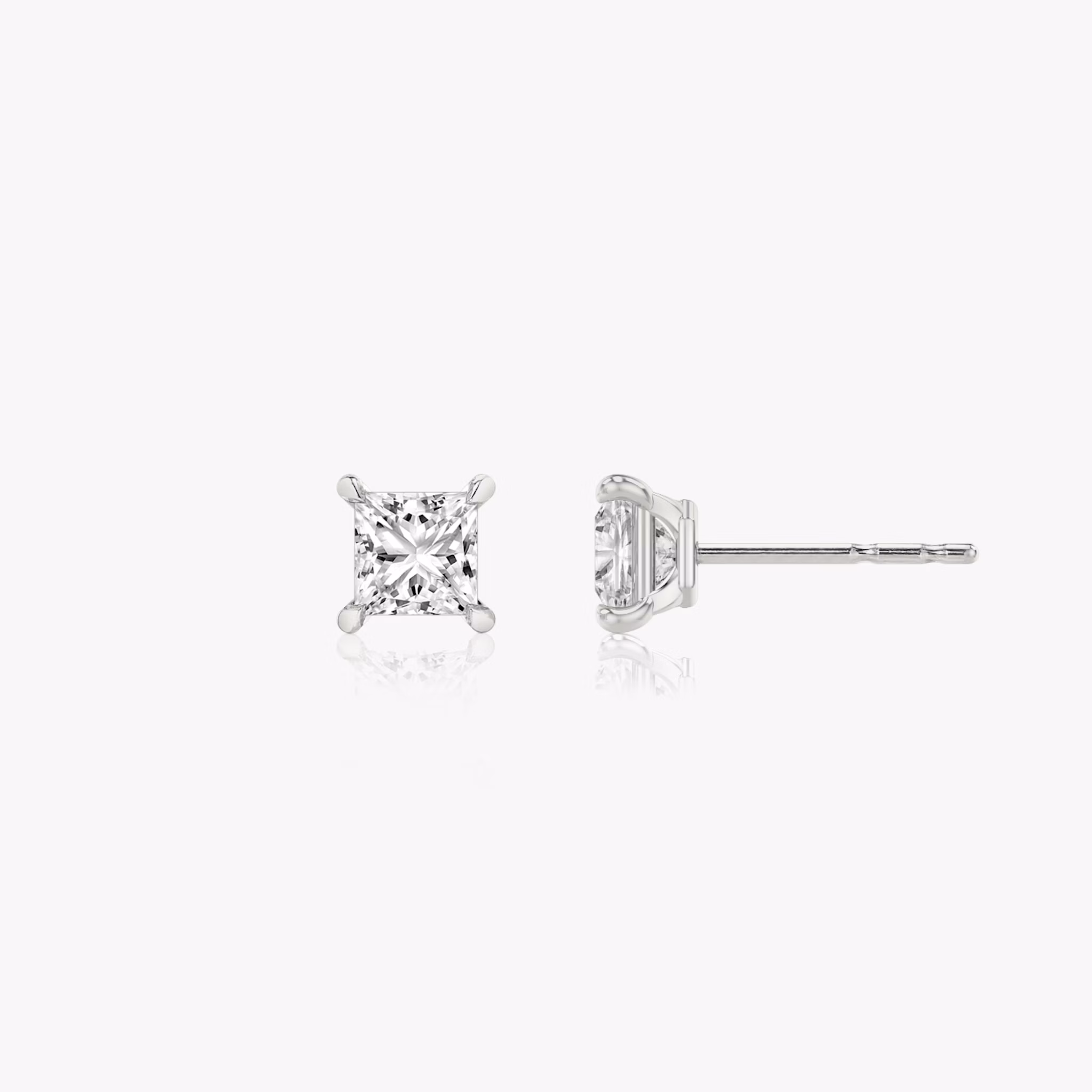 Two studs with a princess cut diamond in white gold side view