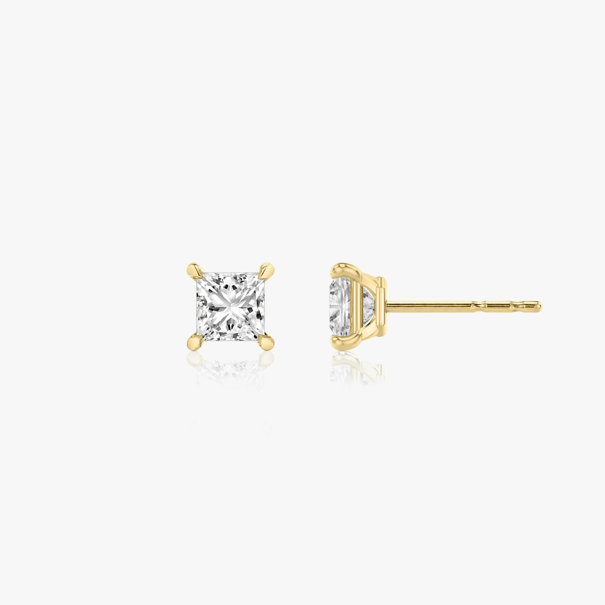 Two studs with a princess cut diamond in yellow gold side view
