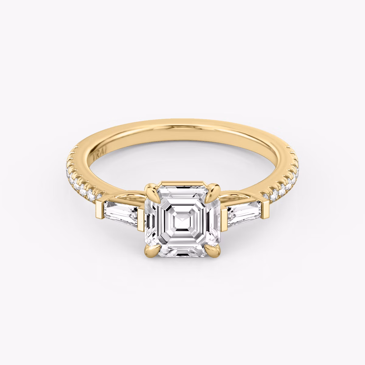 The Three Stone | Asscher | 18k | Yellow Gold | bandAccent: Pavé | sideStoneCarat: 0.10ct | sideStoneShape: Tapered Baguette | diamondOrientation: vertical | caratWeight: other
